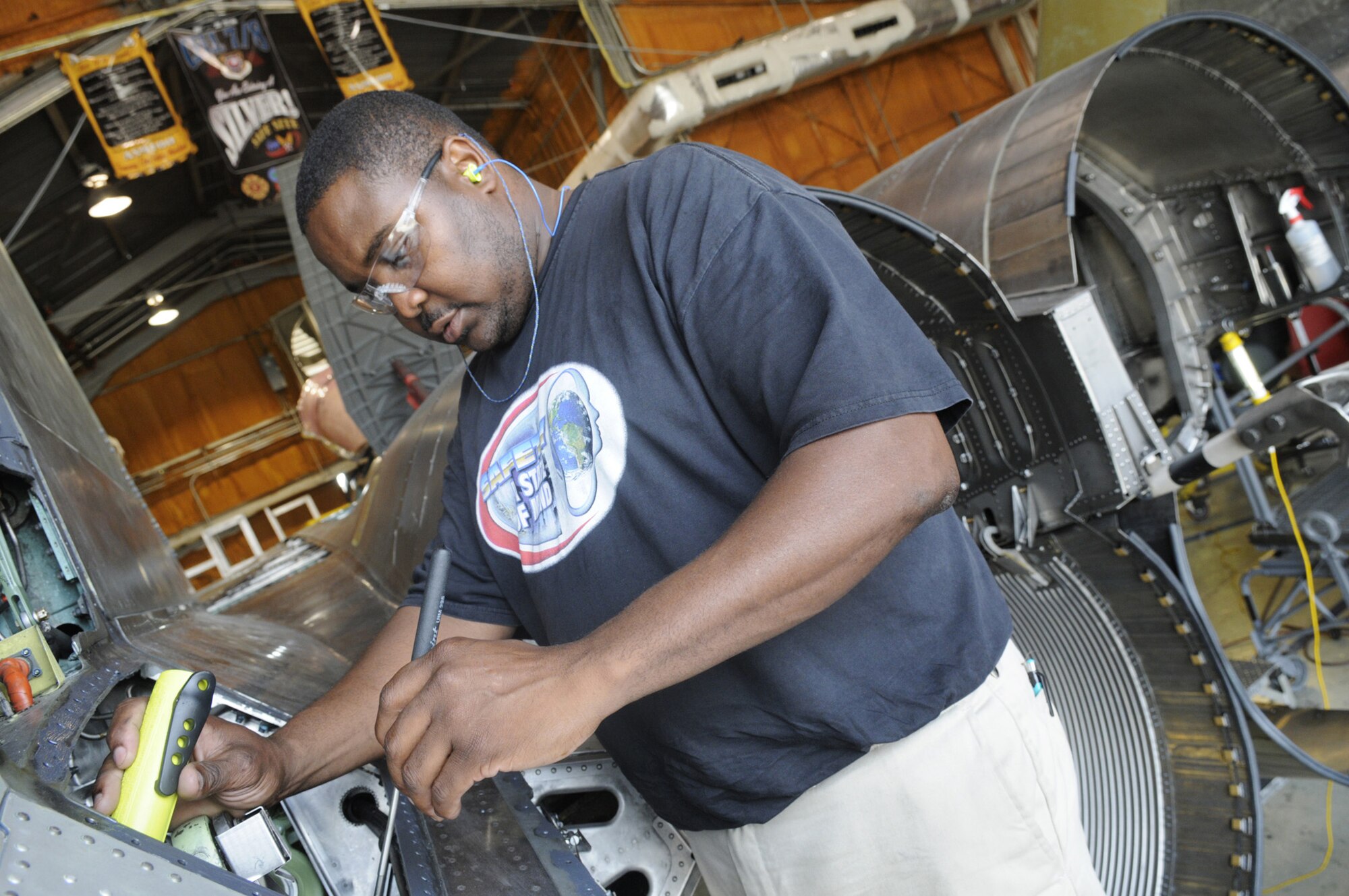 Keith Hall, 561st Aircraft Maintenance Squadron’s B Flight, inspects an F-15 Strike Eagle for foreign object debris before it goes to functional test. U. S. Air Force photo by Sue Sapp