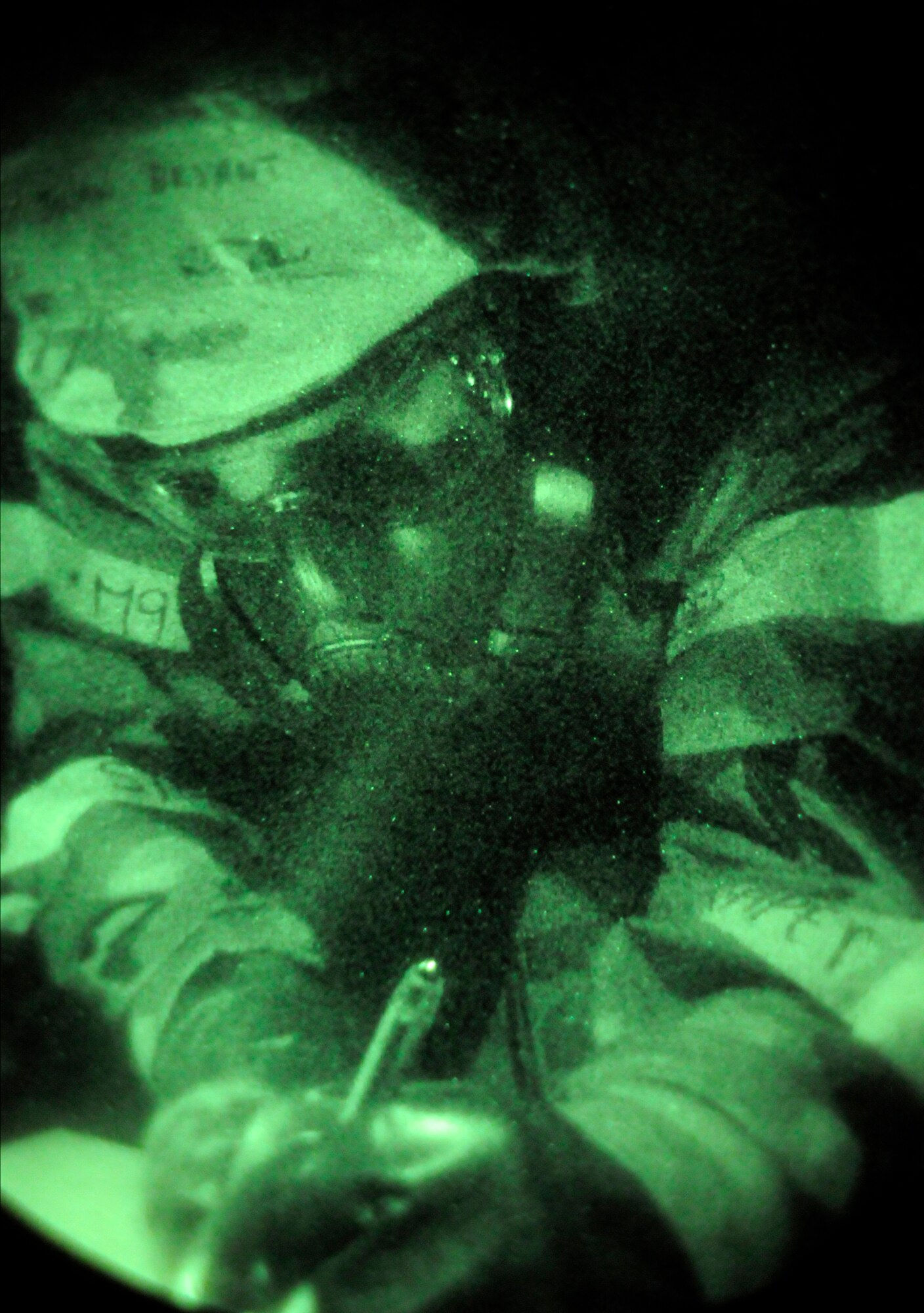 RAF MILDENHALL, England – Post-attack reconnaissance teams check M9 chemical indicator paper to see if there are different color spots indicating contamination during a phase-two exercise at July 22.  If spots are found, they’re circled so that they aren’t confused with new spots that may show up during a later attack.  (U.S. Air Force photo by Staff Sgt. Christopher L. Ingersoll)