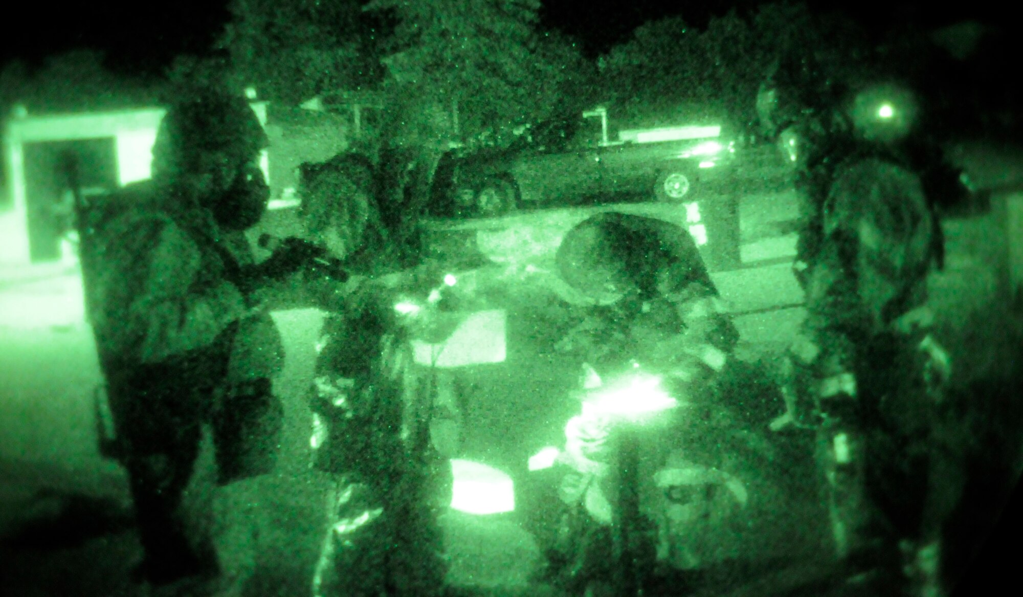 RAF MILDENHALL, England – Post-attack reconnaissance teams check the perimeter of facilities for contamination after a simulated attack during a phase-two exercise July 22.  During phase-two exercises Airmen practice several worst-case scenarios that could happen in a deployed environment including chemical weapons attacks.  (U.S. Air Force photo by Staff Sgt. Christopher L. Ingersoll)