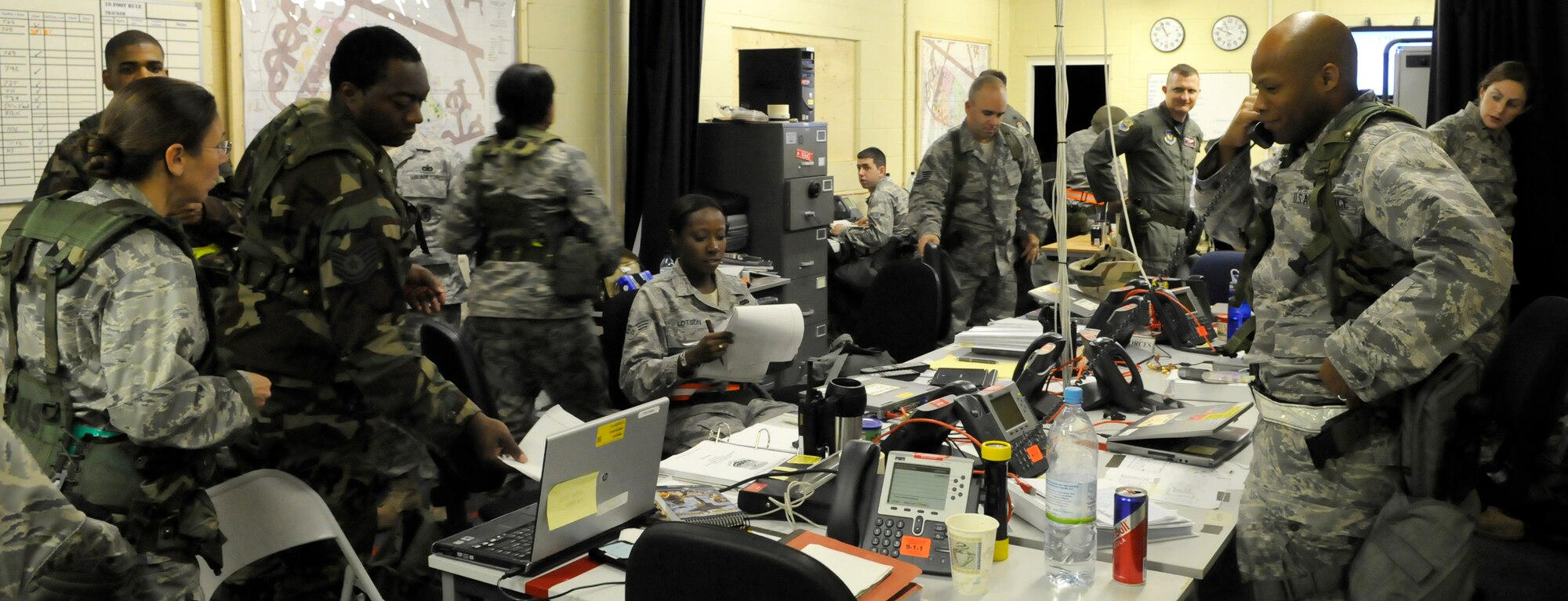 RAF MILDENHALL, England – Airmen in the unit control center relay information and commands to the various agencies participating in a phase-two exercise July 21.  The unit control center is the hub of all operations during an exercise and is often challenged with simulated attacks and various other wartime contingencies.  (U.S. Air Force photo by Staff Sgt. Christopher L. Ingersoll)