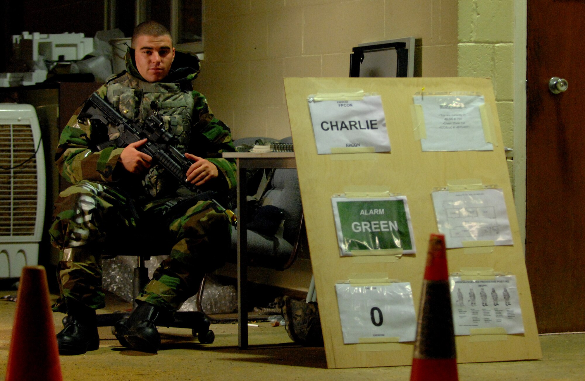 RAF MILDENHALL, England – Airman 1st Class Robert Torrence, 100th Security Forces Squadron, guards the door to the unit control center during a phase-two exercise July 21.  During phase two exercises Airmen carry out 24-hour operations just as they would in real-world operations.  (U.S. Air Force photo by Staff Sgt. Christopher L. Ingersoll)