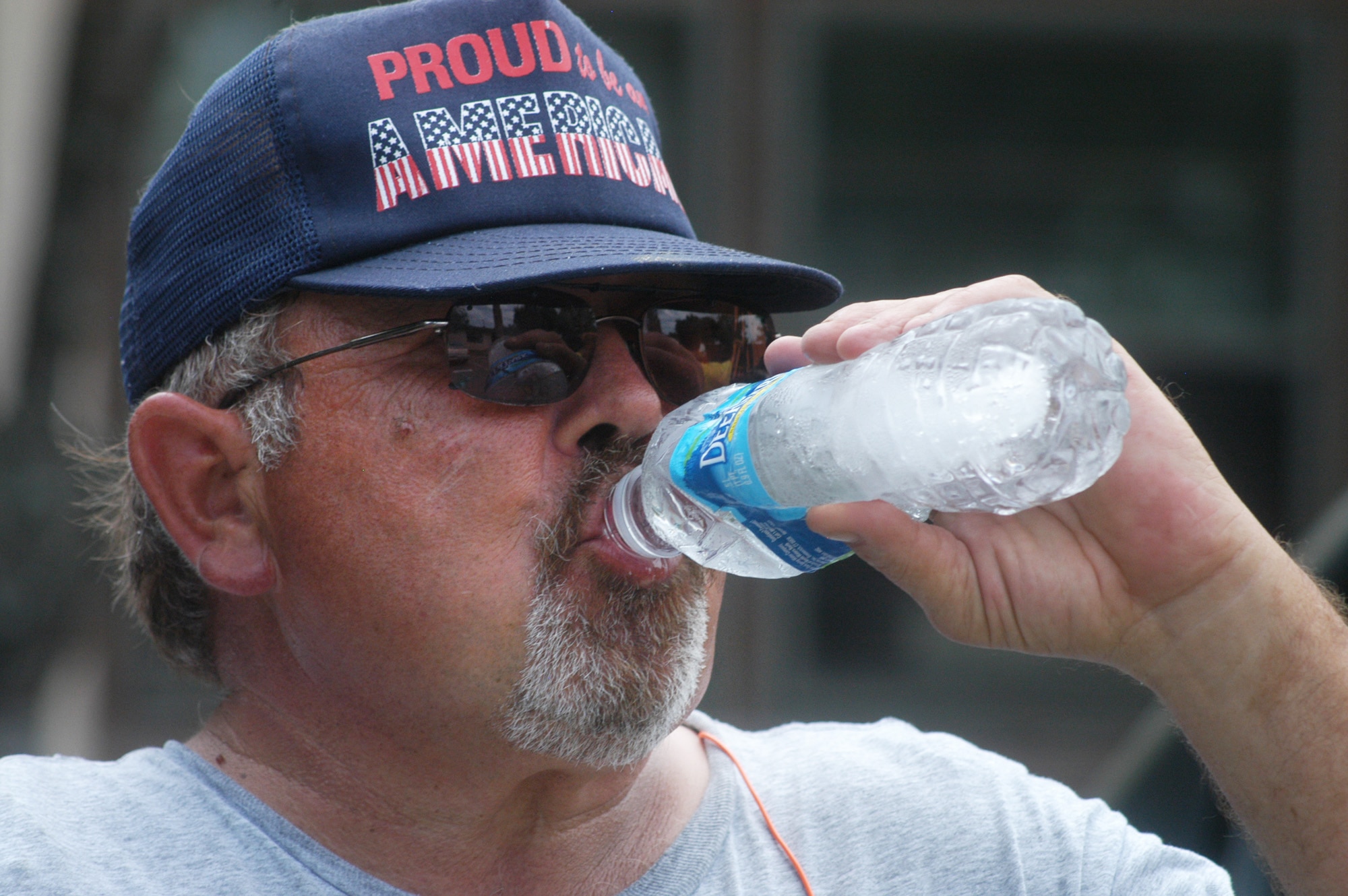 Rick Clark, 78th CES mason, takes a water break while working to stay hydrated. U. S. Air Force photo by Sue Sapp
