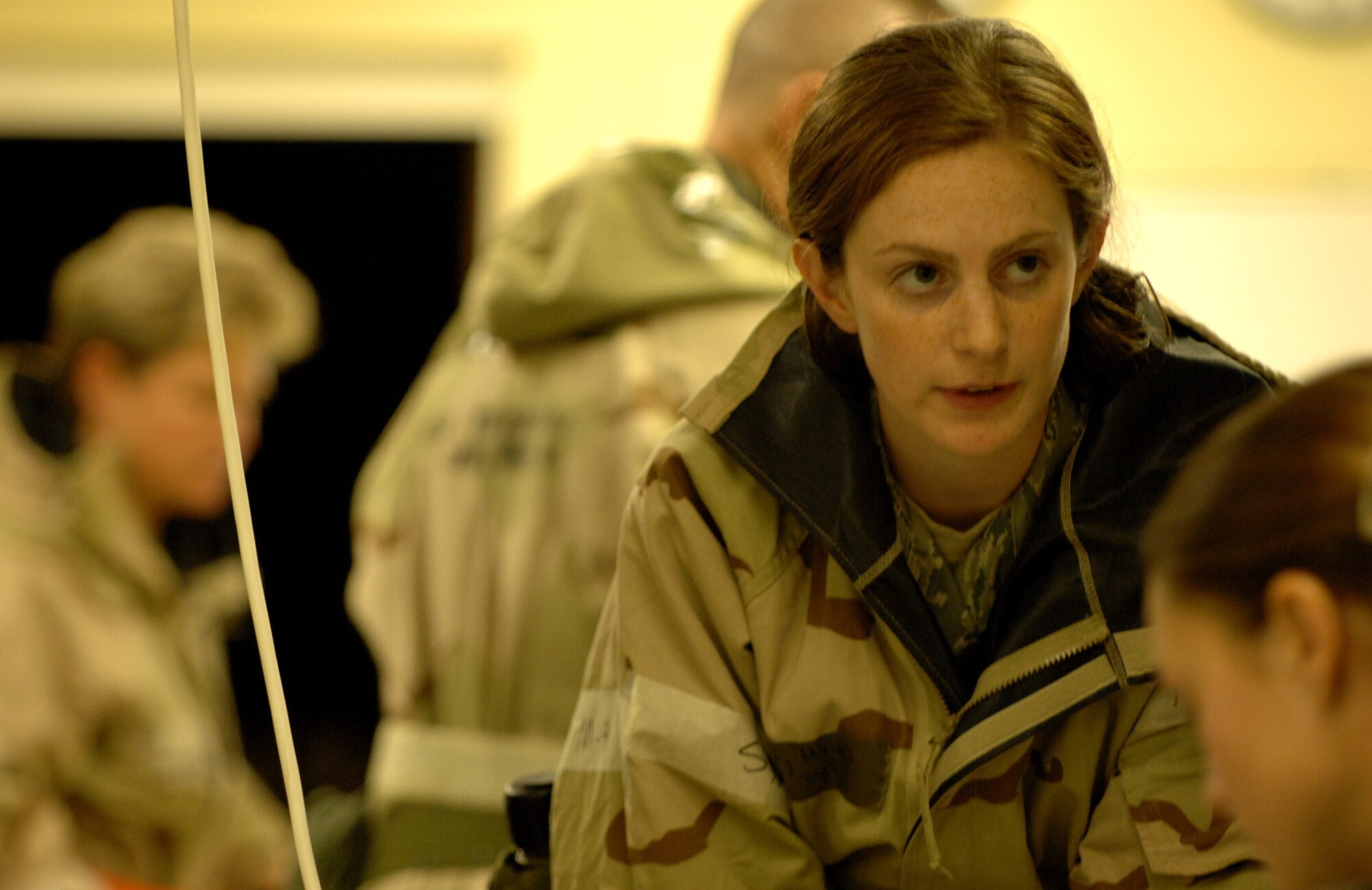 RAF MILDENHALL, England – 1st Lt. Bethany Mettes, 100th Force Support Squadron, relates crucial information to the rest of the unit control center during a phase-two exercise July 21.  Phase-two exercises simulate operations in a deployed environment and are used to practice crucial war fighting skills.  (U.S. Air Force photo by Staff Sgt. Christopher L. Ingersoll)