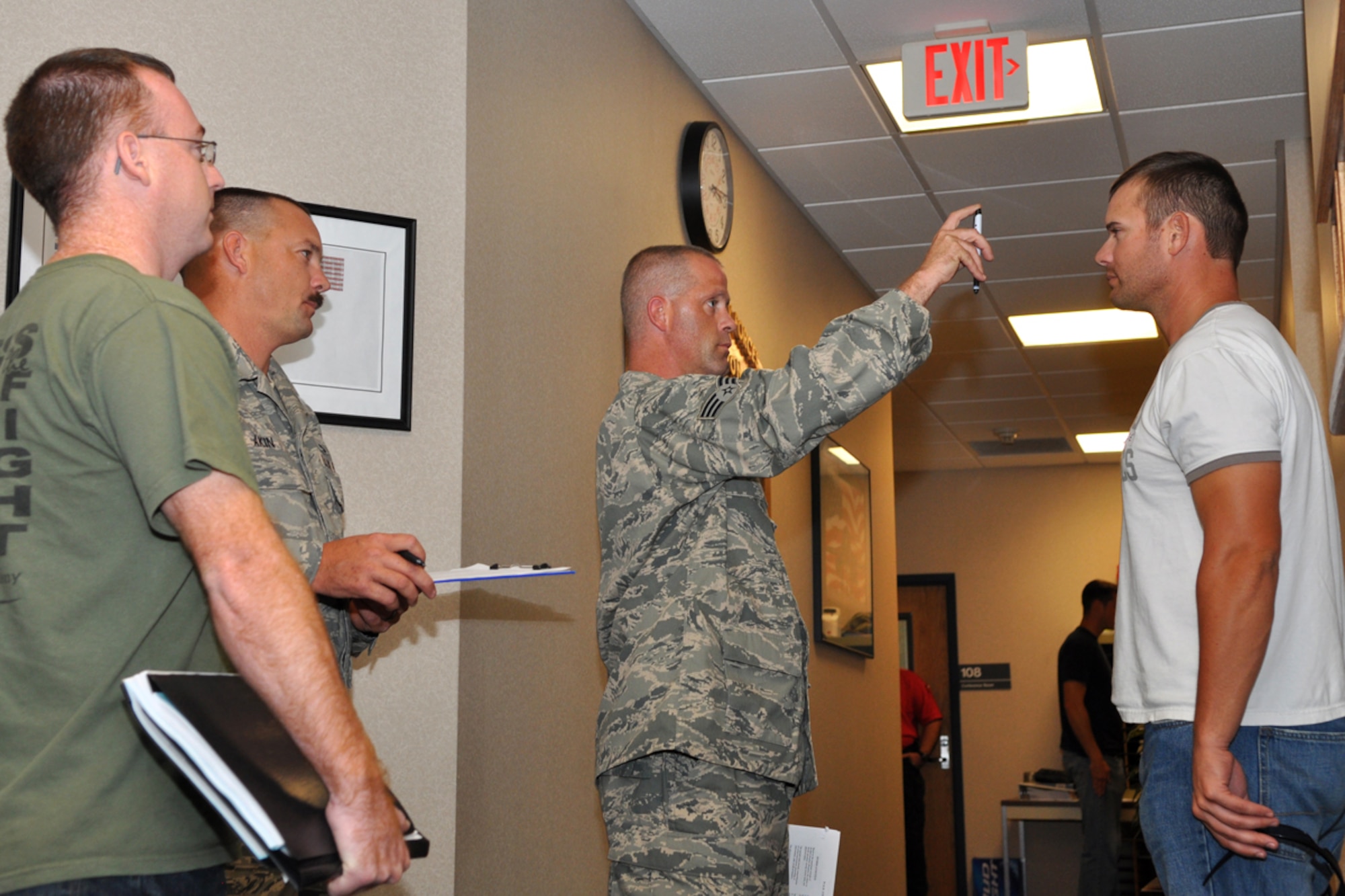 Deputy Johnny Tingle, Red River Sheriff’s Office, observes Senior Airman Randy Patrick performing a sobriety test on intoxicated volunteer number Three as Technical Sgt. Dewayne Akin records the evidence during Standardize Field Sobriety Test training at the 917th Security Forces Squadron facility on Barksdale Air Force Base, La., July 22, 2009. The five days of training covers the three field sobriety tests that comprise the standardized field sobriety test (STST), and other factors that prepare the officers, both civilian and military, to detect impaired persons as well as participate in the legal actions and courtroom procedures that an arrest may entail. Airman Patrick and Sergeant Akin are Reservists assigned to the 917th SFS. Participants who volunteered to become intoxicated for training purposes were given identification numbers rather than using their real names. (U.S. Air Force photo/Tech. Sgt. Jeff Walston)  