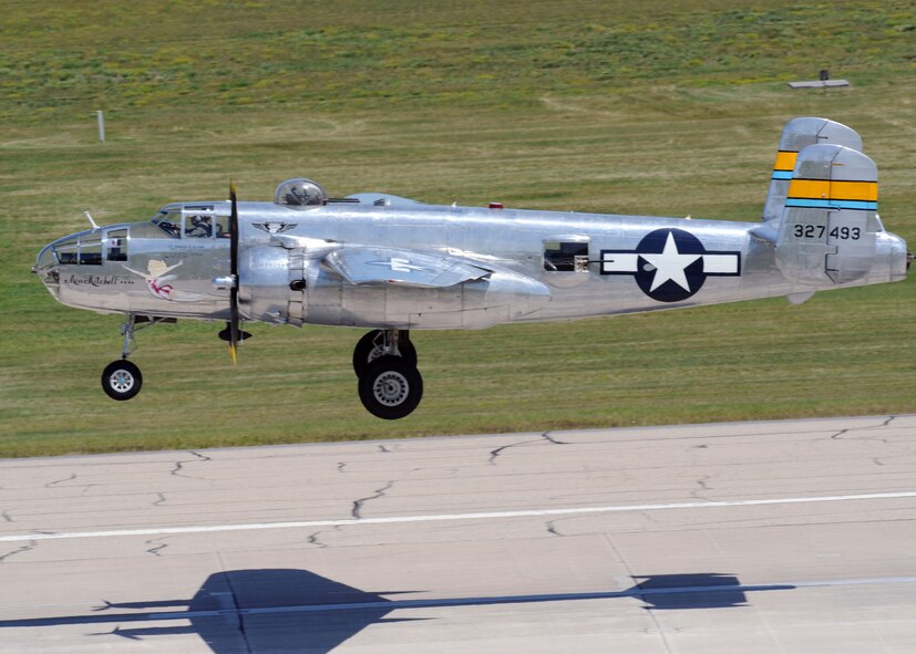 MINOT AIR FORCE BASE, N.D. -- A World War II era B-25 Mitchell Bomber takes off in preparation for its heritage flight at Northern Neighbors Day here July 18. Thousands of people from the base and local community turned out to watch the 2009 Northern Neighbors Day, which came through on its promise to wow spectators with amazing aerial maneuvers, nail-biting choreography, historic displays and much more.  (U.S. Air Force photo by Staff Sgt. Keith Ballard)
