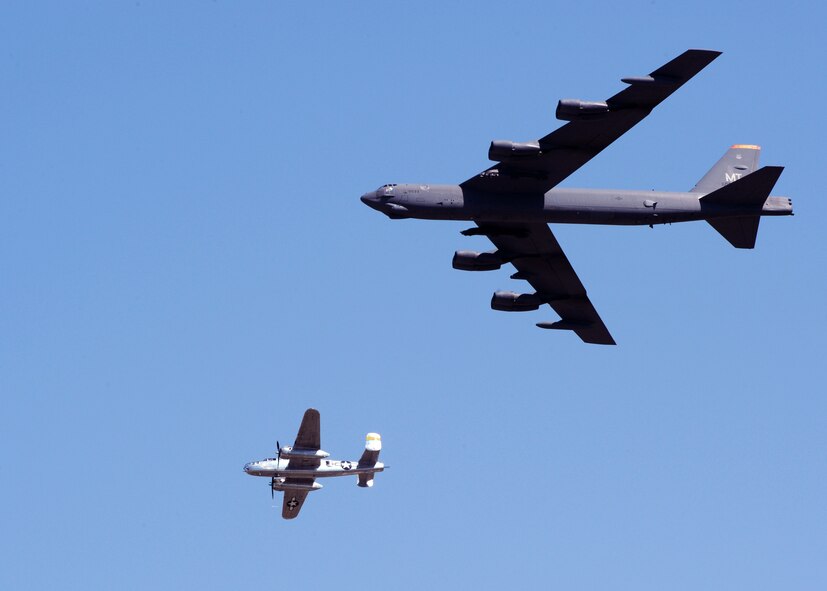 MINOT AIR FORCE BASE, N.D. -- A World War II era B-25 Mitchell Bomber and a modern day B-52H Stratofortress fly together during a U.S. Air Force Heritage Flight demonstrating the past and present of military bombers at Northern Neighbor’s Day here July 18. Thousands of people from the base and local community turned out to watch the 2009 Northern Neighbors Day, which came through on its promise to wow spectators with amazing aerial maneuvers, nail-biting choreography, historic displays and much more.  (U.S. Air Force photo by Staff Sgt. Keith Ballard)
