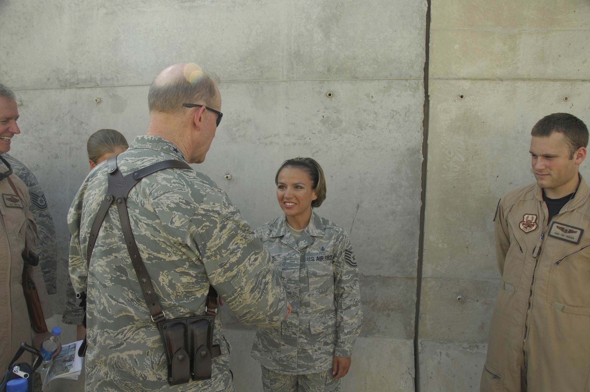Tech. Sgt. Mary Cruz, an independent duty medical technician deployed from the 19th Medical Group to Kandahar Air Field, Afghanistan, meets Air Combat Command commander Gen. John D. Corley. The sergeant was involved in saving the life of a helicopter accident victim the day after this photo was taken. (Courtesy photo)