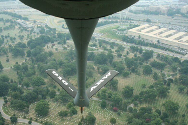 SEYMOUR JOHNSON AIR FORCE BASE, N.C. -- A KC-135R Stratotanker heads to a fly-over event at Arlington National Cemetery on July 22, 2009. In the background  is the Air Force Memorial. (U.S. Air Force photo by: Tech. Sgt. Jonathan Taylor, 911th Air Refueling Squadron)