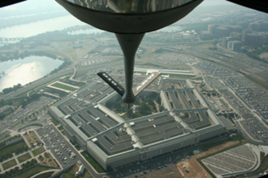 SEYMOUR JOHNSON AIR FORCE BASE, N.C. -- A KC-135 Stratotanker from the 916th Air Refueling Wing flies over the Pentagon on its way to a ceremony at Arlington National Cemetery on July 22. The fly-over was to honor service members from Vietnam that were changed from missing in action to killed in action. (U.S. Air Force photo by: Tech. Sgt. Jonathan Taylor, 911th Air Refueling Squadron)