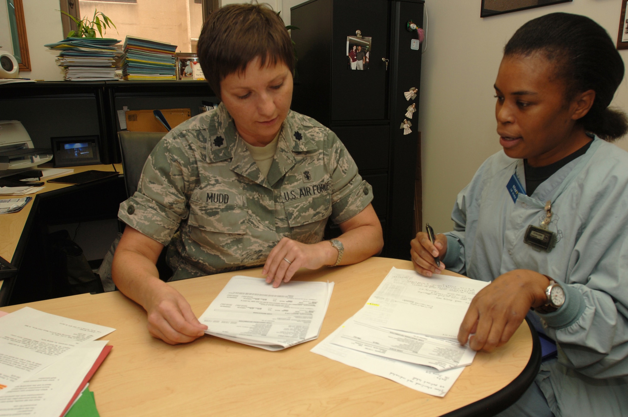 Lt. Col. Jacqueline Mudd (left), Operating Room Flight commander, 59th Surgical Operations Squadron, looks over flash sterilization data with Capt. Yvonne Storey, operating room nurse, 59th Surgical Operations Squadron.  Colonel Mudd was chosen the 2009 recipient of the General Benjamin O. Davis, Jr. Military Award by the Tuskegee Airmen Incorporated.  (Air Force photo by Senior Airman Nicole Roberts)