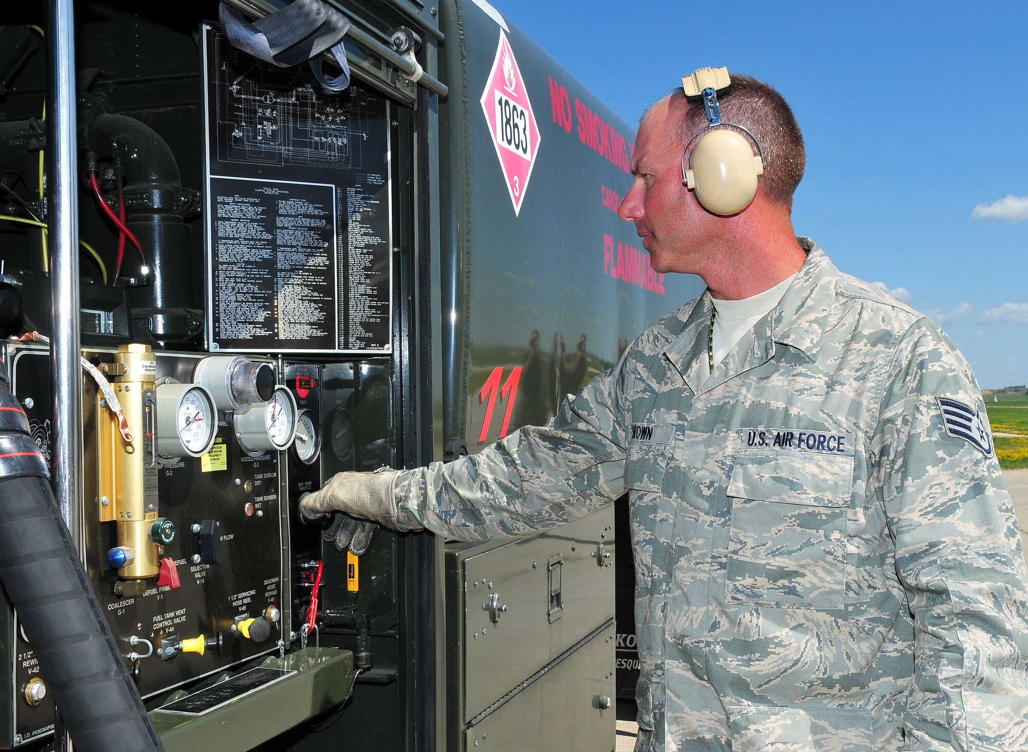 Staff Sgt. Patrick Brown, Refueling Unit Operator for the Wisconsin Air National Guard's 115th Fighter Wing monitors the fuel flow rate during hot pit refuel operations at Dane County Regional Airport on June 28, 2009. Hot pit refueling provides rapid sortie generation by allowing 115FW F-16 aircraft to refuel and return to flight without shutting down their engines.  (U.S. Air Force photo by Master Sgt. Paul Gorman)