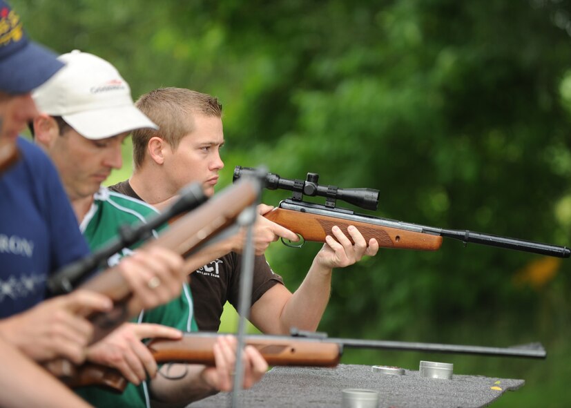 Senior Airman Mark Skinner, 9th Bomb Squadron, loads a pellet gun during the Royal International Air Tattoo crew challenge here July 17. Airman Skinner and three teammates participated in five different physical challenges. The rifle challenge tested the teamwork between the different countries such as Canada, Ireland, Spain and Germany. (U.S. Air Force photo by Senior Airman Jennifer Romig)