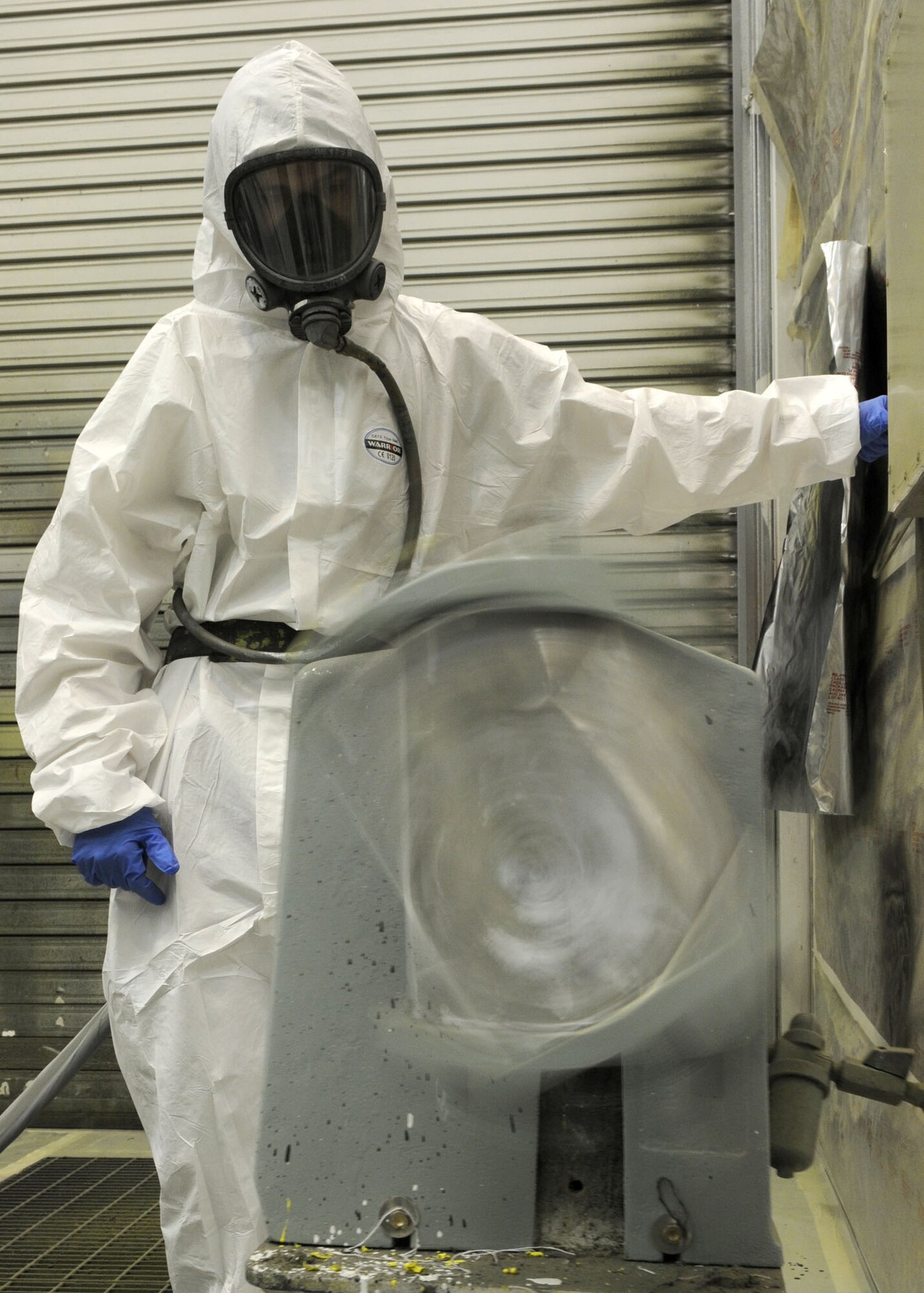 RAF MILDENHALL, England--Airman 1st Class Robert Greenwell, 100th Maintenance Squadron, aircraft structural maintenance technician, agitates a can of paint prior to spaying a set of aircraft wheels June 16, 2009. Airman Greenwell shakes things up to mix together the ingredients that have settled at the bottom of the paint can. (U.S. Air Force photo by Staff Sgt. Jerry Fleshman)
