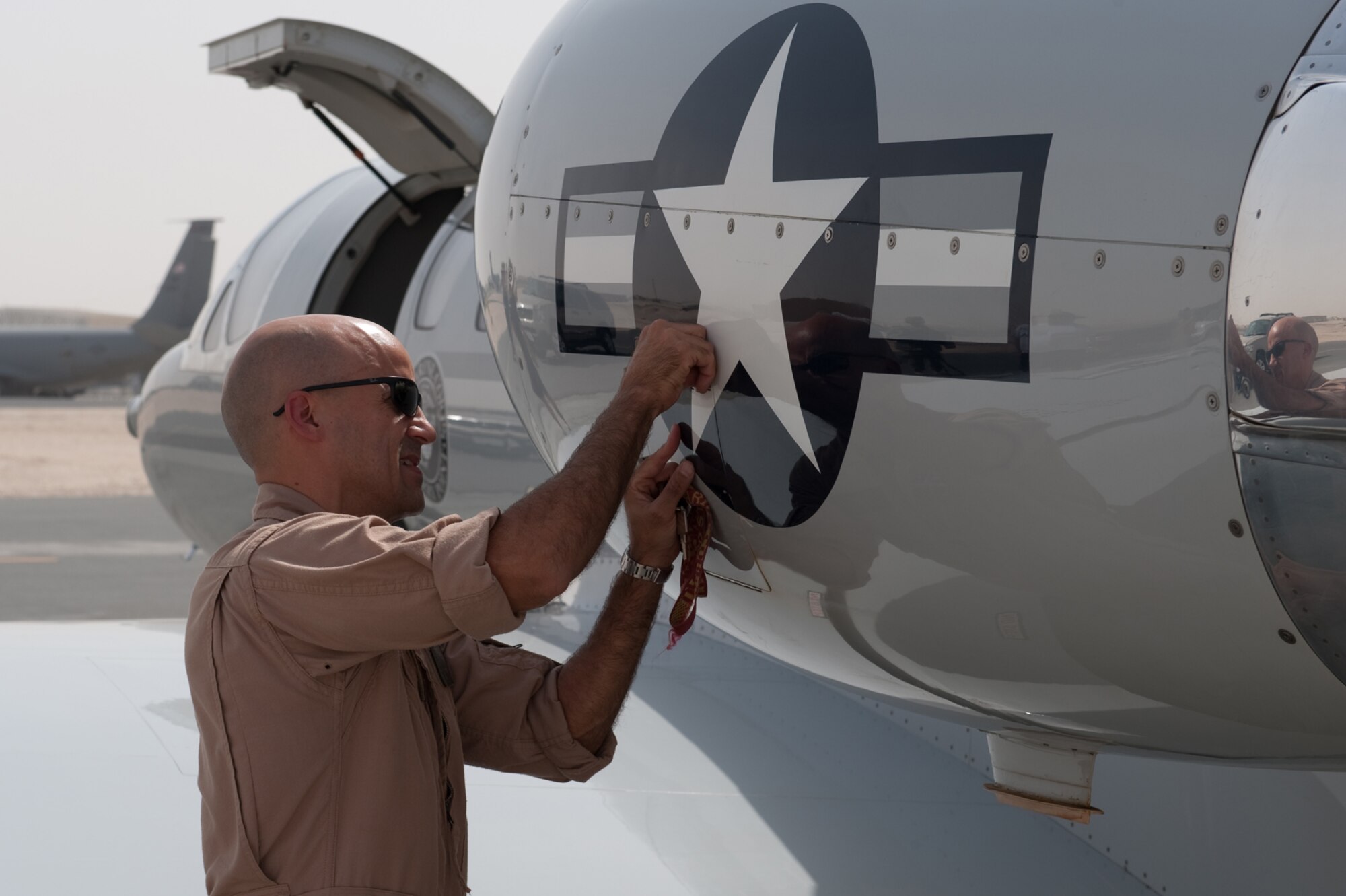 Marine Maj. Enrique Bougeois, Fixed Wing Marine Transport Detachment 4 pilot, performs a preflight check on a UC-35 prior to takeoff, July 16, in Southwest Asia. The UC-35 provides quick airlift capabilities for personnel and equipment throughout Southwest Asia. Major Bougeois is a native of Ponce, Puerto Rico and is deployed from Belle Chasse Naval Air Station, La., in support of Operations Iraqi and Enduring Freedom. (U.S. Air Force Photo/Staff Sgt. Robert Barney)