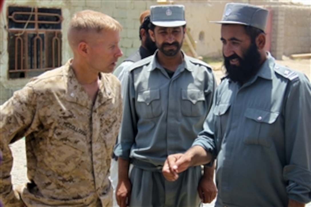 U.S. Marine Corps Lt. Col. William McCollough talks with the chief of police in the Nawa district of the Helmand province of Afghanistan on July 19, 2009.  McCollough is the commander of 1st Battalion, 5th Marine Regiment, Regimental Combat Team 3, 2nd Marine Expeditionary Brigade-Afghanistan.  