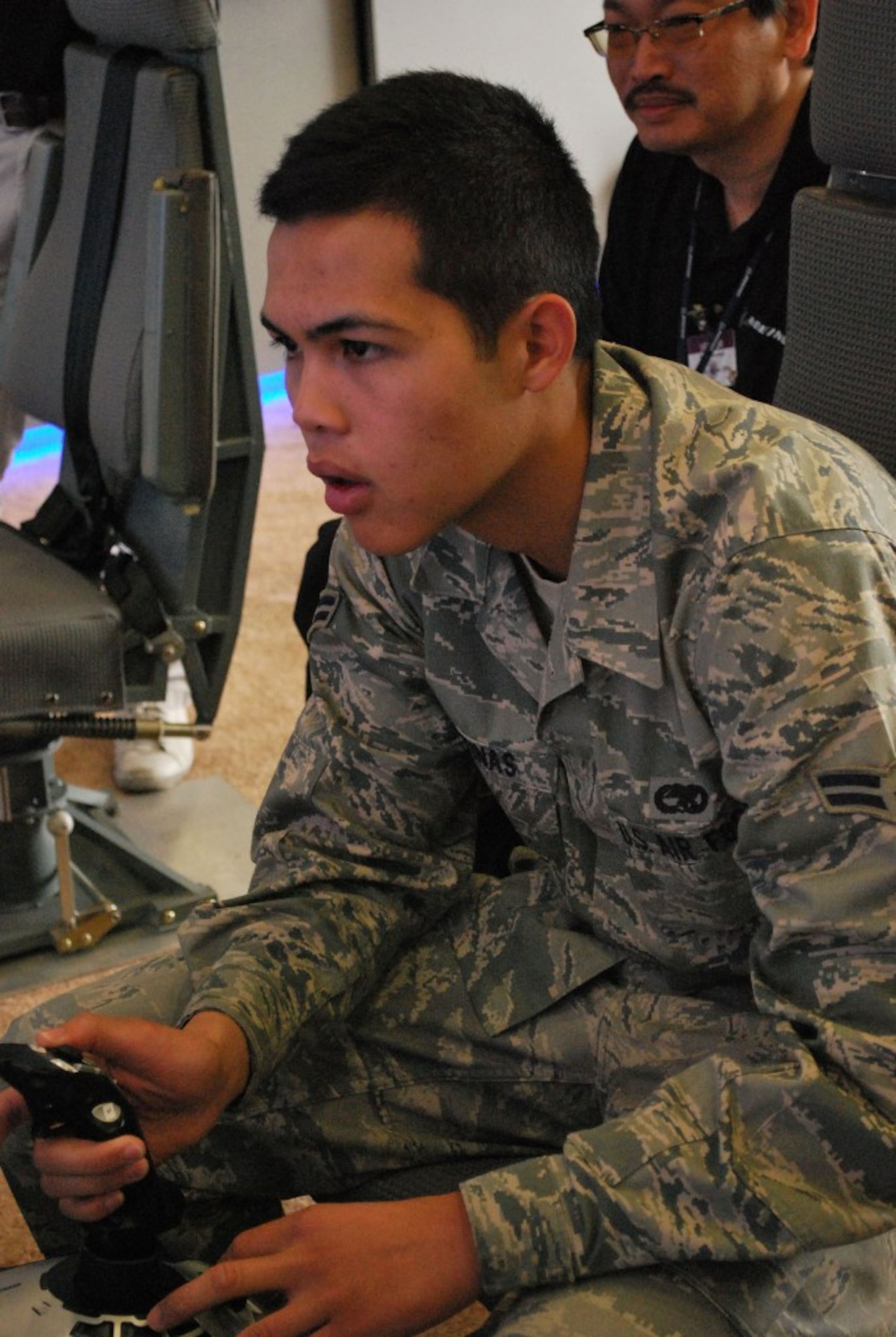 Airman 1st Class Jason Gontinas, 446th Airlift Wing crew chief, tries to beat the assult launding simulator record of 54 seconds July 23, 2009, at McChord Air Force Base, Wash. (U.S. Air Force Photo/Master Sgt. Collen McGee)