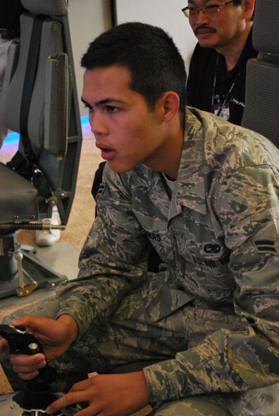 Airman 1st Class Jason Gontinas, 446th Airlift Wing crew chief, tries to beat the assult launding simulator record of 54 seconds July 23, 2009, at McChord Air Force Base, Wash. (U.S. Air Force Photo/Master Sgt. Collen McGee)