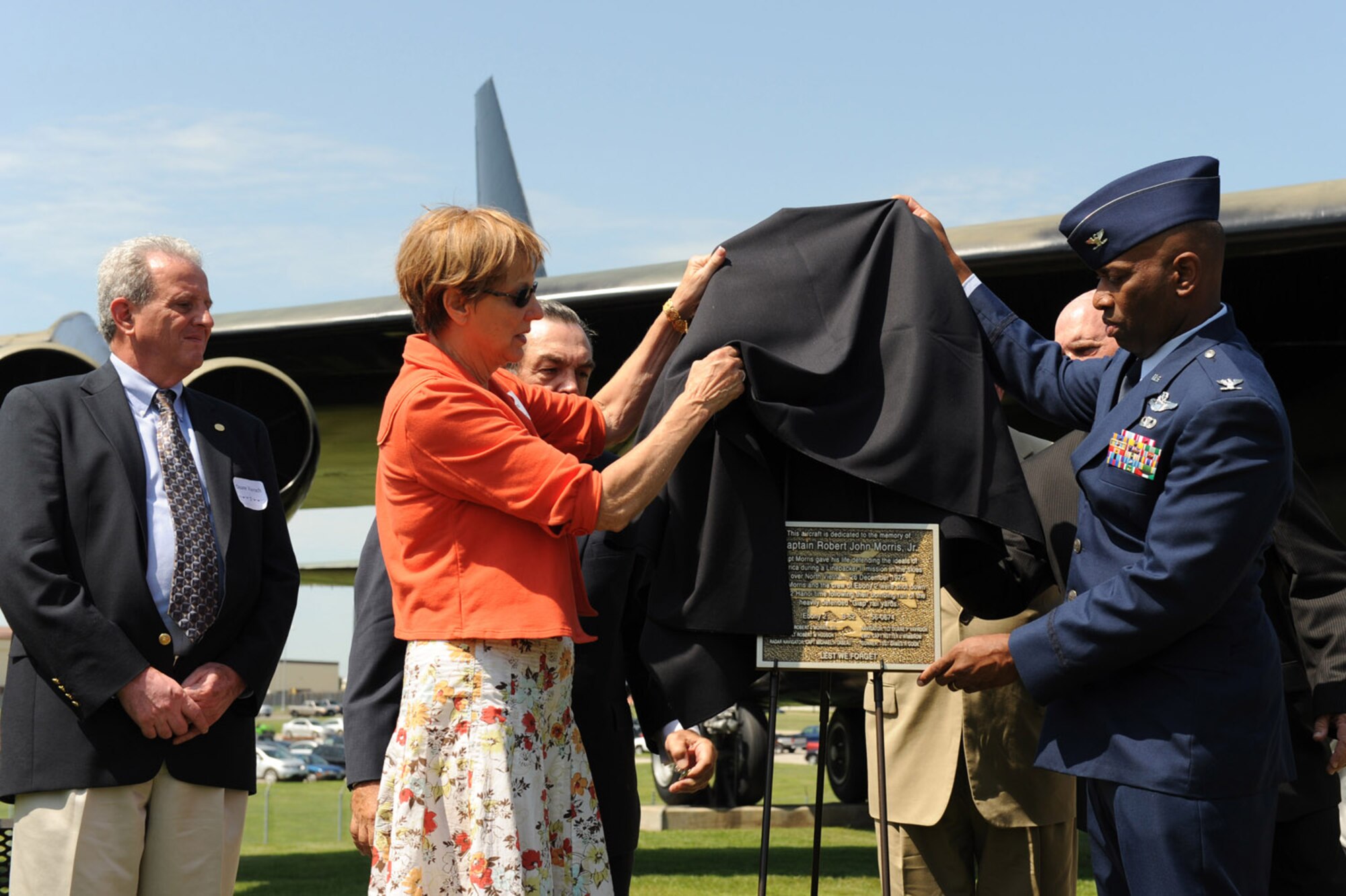 WHITEMAN AIR FORCE BASE, Mo. - Col. Rickey Rodgers, 509 Bomb Wing vice commander, and members Ebony-02 crew unveil the plaque dedicating the B-52 static display to Capt. Robert J. Morris Jr., at the B-52 dedication ceremony July 24. A B-52 static display was dedicated to Capt. Robert J. Morris Jr. who flew during Operation Linebacker II during the Vietnam War. Many veterans associations were in attendance Friday as well as members of Team Whiteman. (U.S. Air Force photo/Senior Airman Jason Huddleston)
