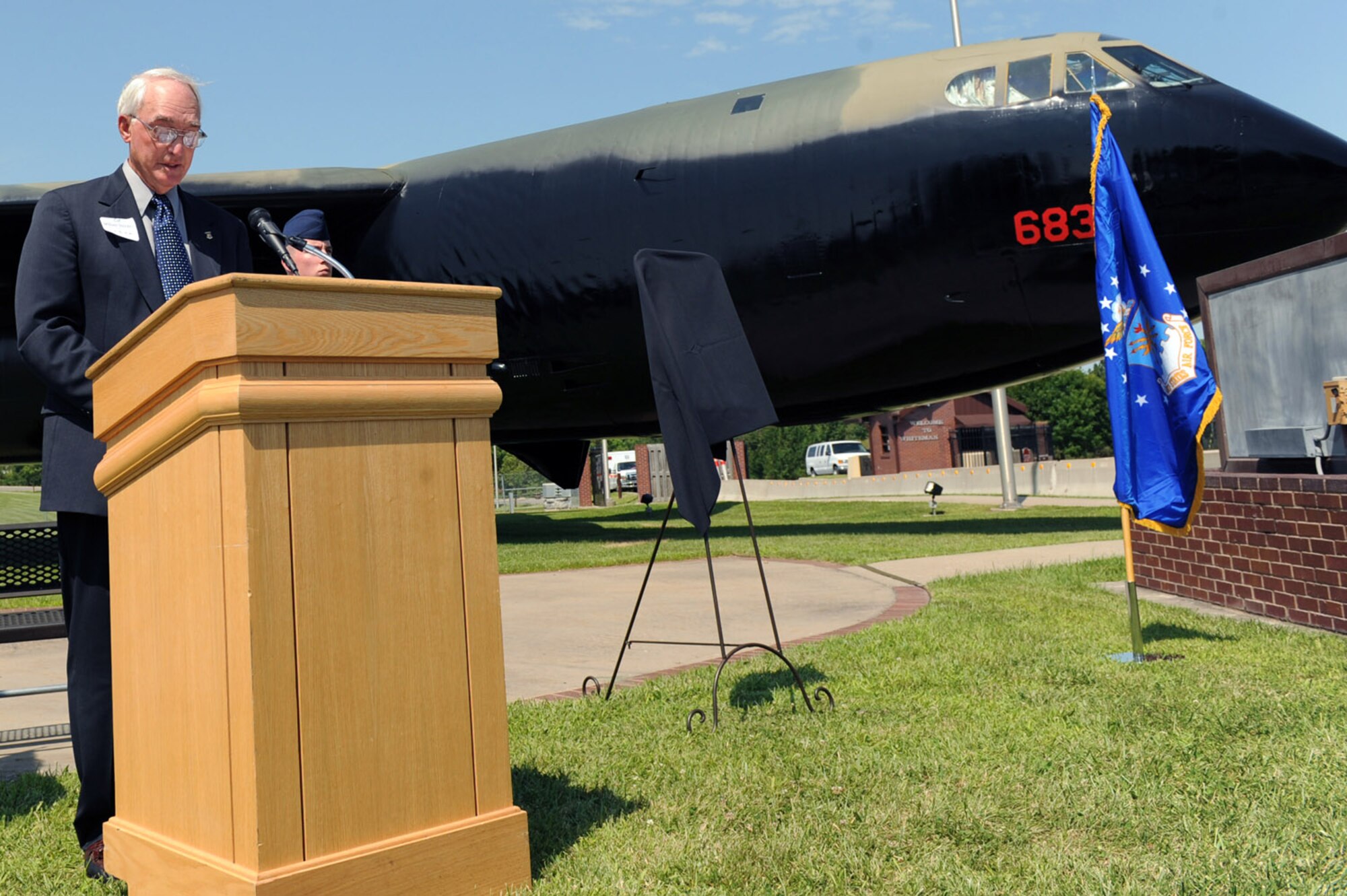 WHITEMAN AIR FORCE BASE, Mo. - Col. (Ret.) William Stocker speaks at the B-52 dedication ceremony July 24. A B-52 static display was dedicated to Capt. Robert J. Morris Jr. who flew during Operation Linebacker II during the Vietnam War. Many veterans associations were in attendance Friday as well as members of Team Whiteman. (U.S. Air Force photo/Senior Airman Jason Huddleston)