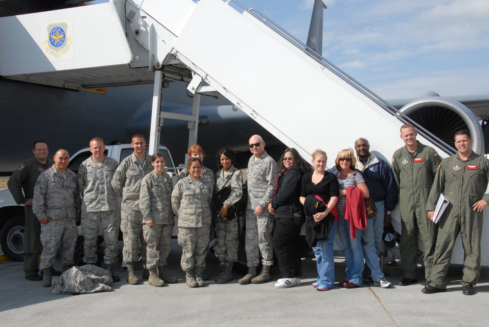 Personnel from the 477th Fighter Group and the 3rd Wing here at Elmendorf Air Force Base pose with a crew from the 434th Air Refueling Wing from Grissom Air Reserve Base, Indiana, after an orientation flight on July 14.  During the flight the personnel were able to watch six F-22A Raptors refuel twice during a training mission. The KC-135 crew, from the 434th Air Refueling Wing, came from Grissom ARB to support the 477th FG's first-flying Unit Training Assembly in July.  The team flew several personnel and spouses from the 477th FG and the 3rd Wing here on orientation flights, showcasing the KC-135 and F-22 refueling capabilities and how the units work together in flight. (Air Force Photo / Maj. Cary McPartlin)