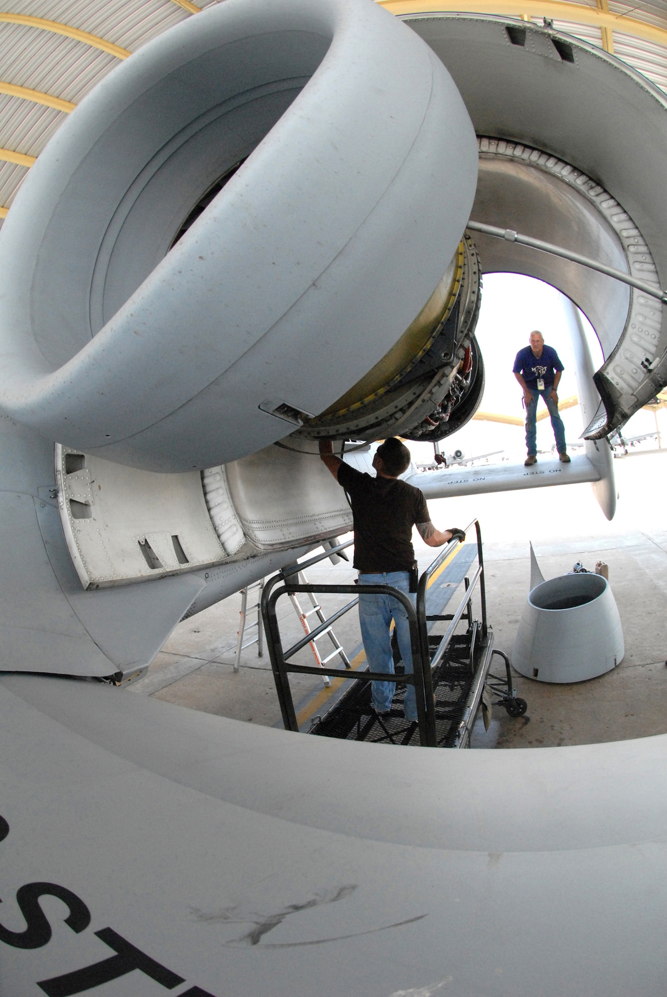 David Greenberg, left, and John Ezell, prepare a TF-34-100A turbo fan engine for removal from an A-10 Thunderbolt II at Whiteman Air Force Base, Mo., June 2.  This particular engine set a longevity record in the 442nd Fighter Wing after being installed on the same aircraft, tail number 605, for 10 years and accumulating 3,464.4 hours of operating time.  Both men are Air Reserve Technician crew chiefs in the 442nd Maintenance Squadron.  The 442nd is an Air Force Reserve unit based at Whiteman.  (U.S. Air Force photo/Master Sgt. Bill Huntington)