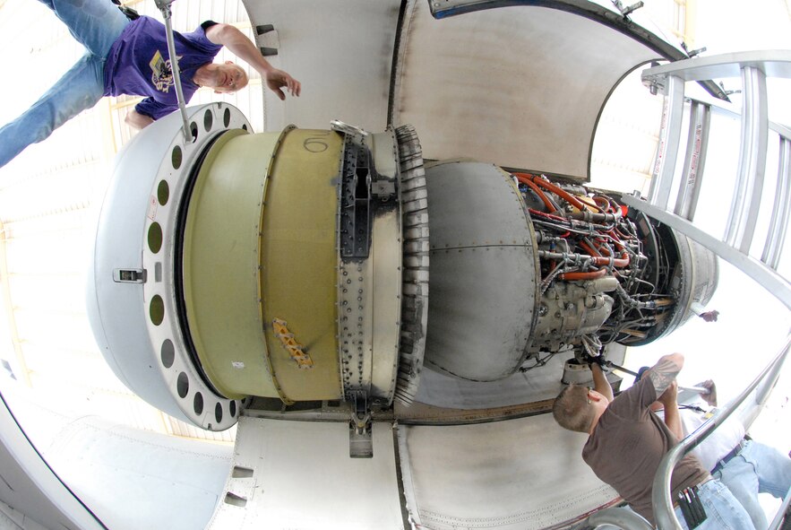 John Ezell, left; David Greenberg and Bob Boye remove a TF-34-100A turbo-fan engine from A-10 Thunderbolt, tail-number 605, Jun 2 on the aircraft-parking ramp at Whiteman Air Force Base, Mo.  This particular engine set a record in the 442nd Fighter Wing by staying on the same airplane for 10 years and accumulating 3,464.4 hours since it was installed in June 1999.  The three men are crew chiefs in the 442nd Aircraft Maintenance Squadron, part of the 442nd FW, an Air Force Reserve unit based at Whiteman.  (U.S. Air Force photo/Master Sgt. Bill Huntington)