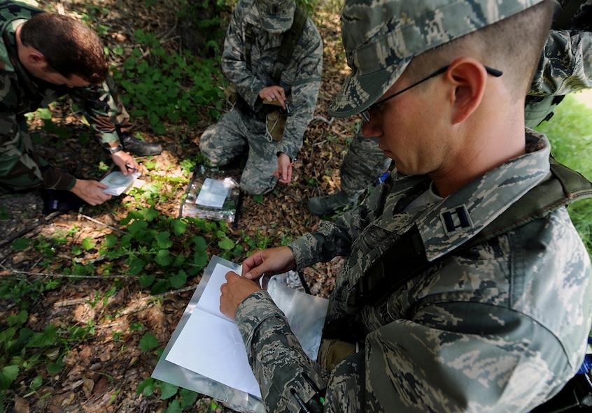 MOODY AIR FORCE BASE Ga. – Capt. Mathew Robinson, 57th Information Aggressor Squadron influence operator at Nellis Air Force Base, Nev., prepares for a land navigation assignment here July 21. Captain Robinson was part of the first of four groups during the assignment. (U.S. Air Force photo by Airman 1st Class Joshua Green)