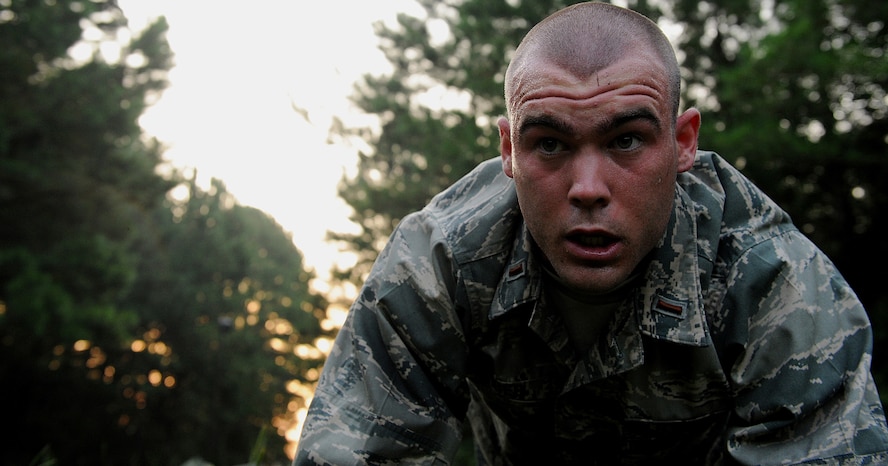 MOODY AIR FORCE BASE, Ga. -- 2nd Lt. Zachary Reiger uses the last of his strength to finish 50 push-ups during a grass-guerilla drill here July 22. Candidates looking to qualify for the air liaison career field go through rigorous physical and mental challenges to see if they qualify for the position. (U.S. Air Force photo by Airman 1st Class Joshua Green)  