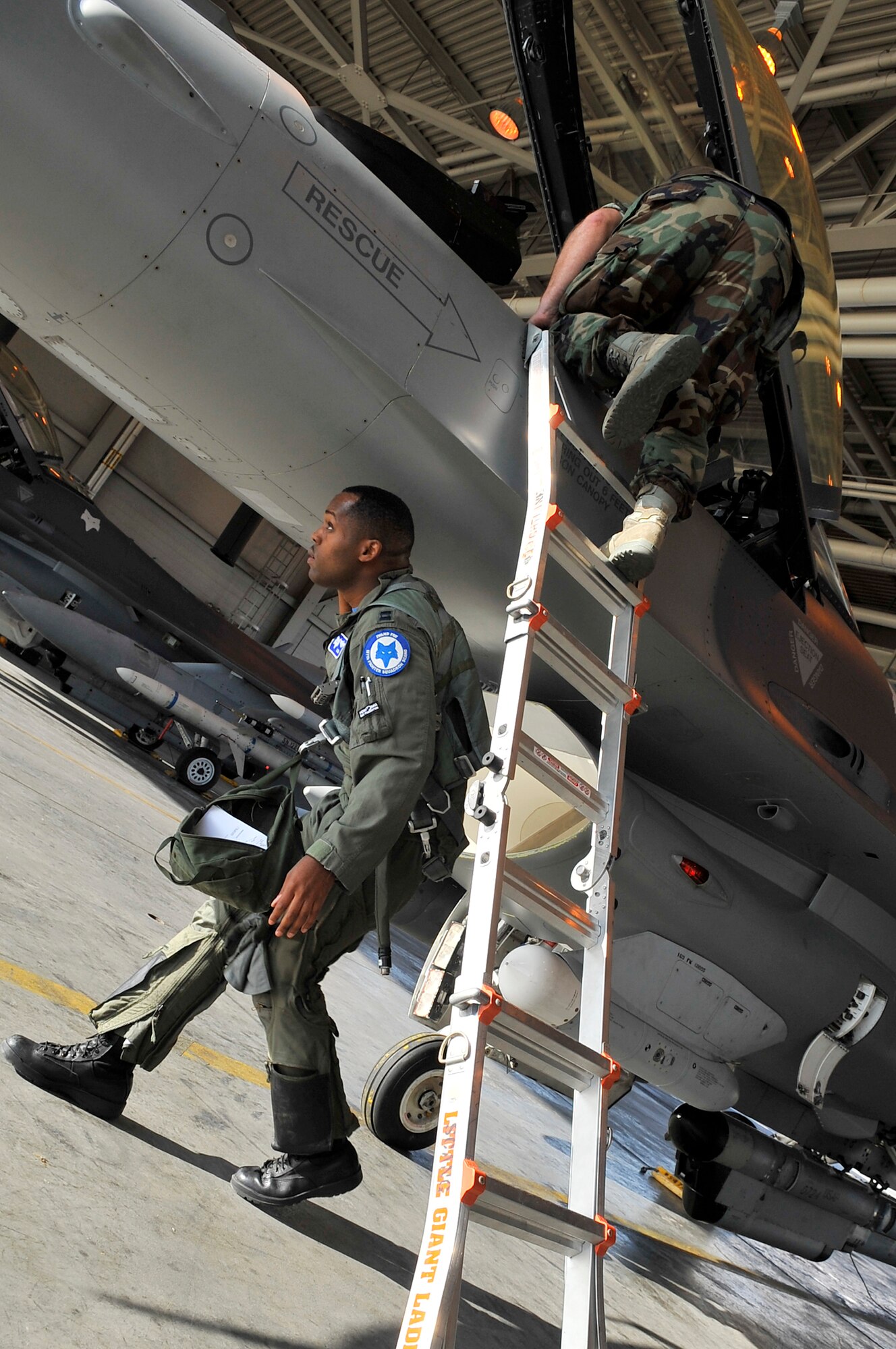 Capt. Taj Troy inspects his F-16 prior to launching during Red Flag-Alaska 09-3 July 24, 2009, Eielson Air Force Base. RF-A provides unique opportunities to integrate various forces into joint, coalition and bilateral training from a simulated forward operating base. Captain Troy is an F-16 pilot assigned to the 157th Fighter Squadron, 169th Fighter Wing, South Carolina Air National Guard. (U.S. Air Force photo/Staff Sgt. Christopher Boitz)