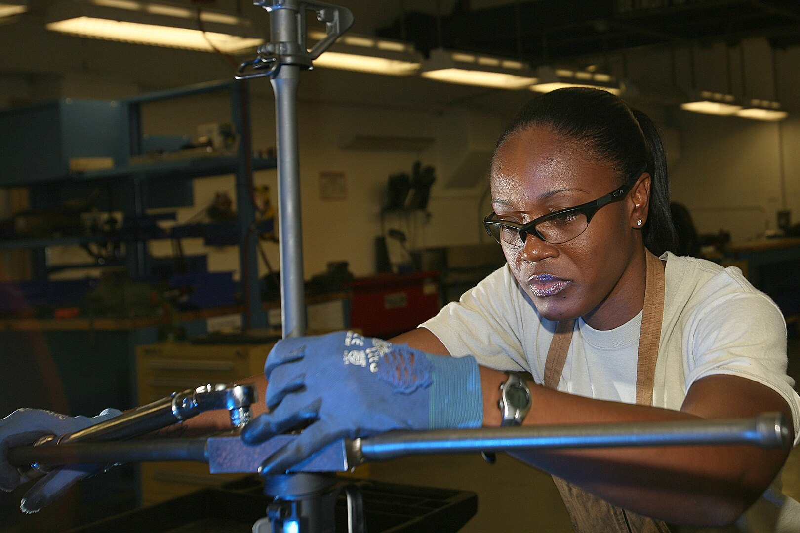 Tech. Sgt. Margery Martin, 575th Combat Sustainment Squadron, installs the barrel of an M16a2 assault rifle receiver at the gunsmith shop on Lackland's Training Annex. The only gunsmith shop in the Air Force, it focuses on the transfer of Marine and Army M16a2 assault rifles into the hands of Airmen. (U.S. Air Force photo/Robbin Cresswell)