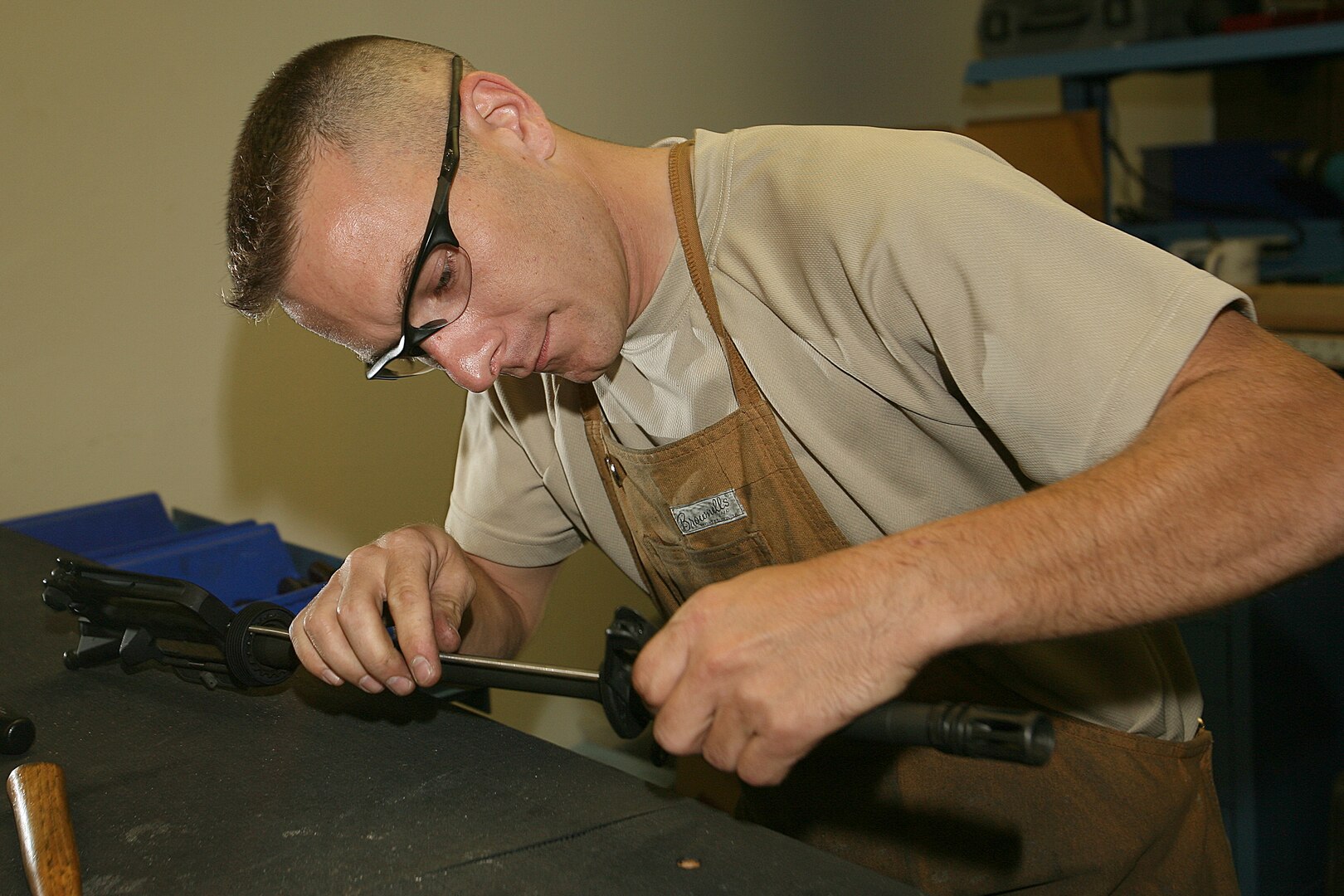 Tech. Sgt. Brendan McGloin, 575th Combat Sustainment Squadron, builds the upper receiver of an M16a2 rifle at the gunsmith shop on Lackland's Training Annex. The only gunsmith shop in the Air Force, it focuses on the transfer of Marine and Army M16a2 assault rifles into the hands of Airmen. (U.S. Air Force photo/Robbin Cresswell)