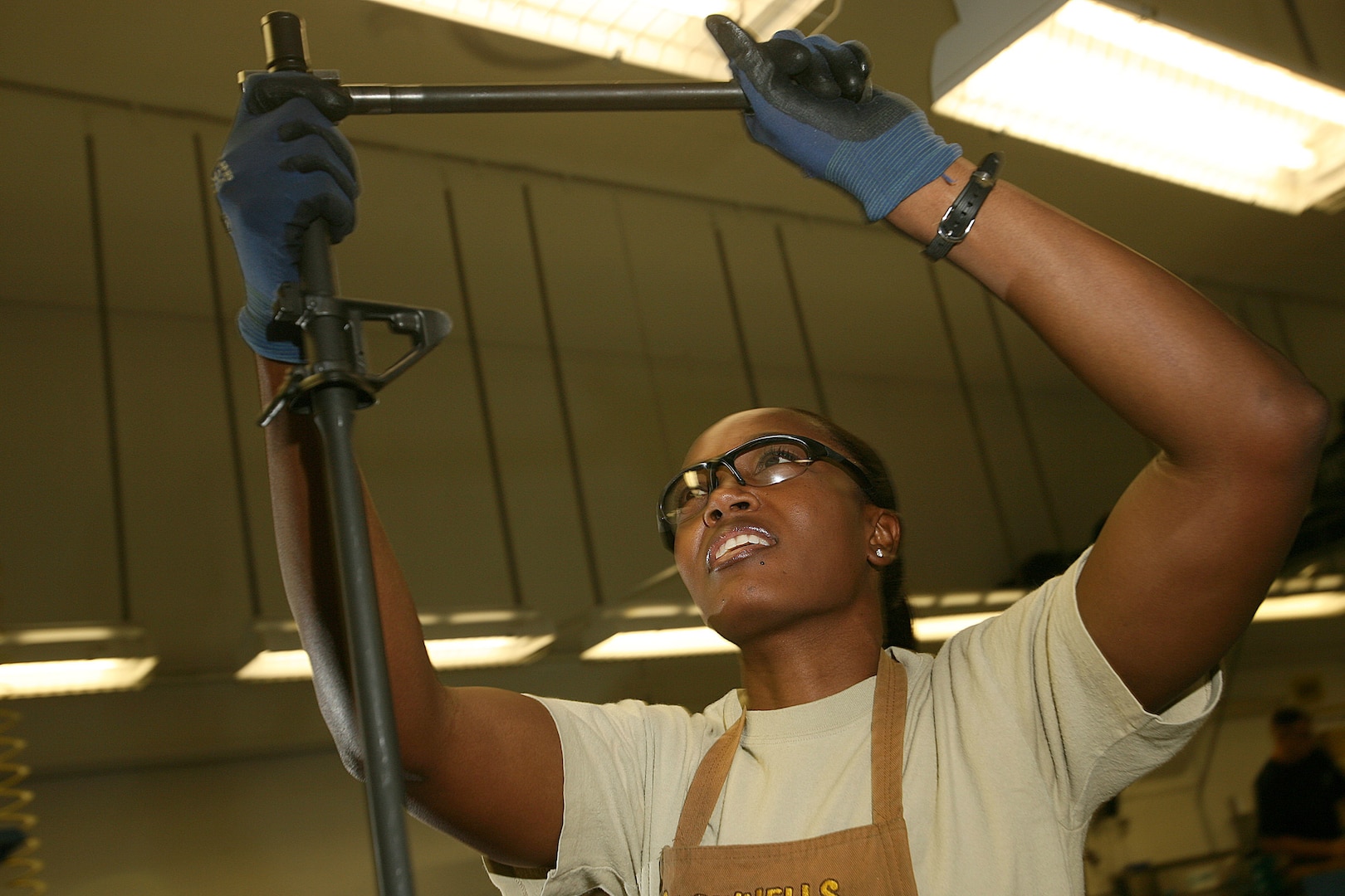 Tech. Sgt. Margery Martin, 575th Combat Sustainment Squadron, installs the barrel of an M16a2 assault rifle receiver at the gunsmith shop on Lackland's Training Annex. The only gunsmith shop in the Air Force, it focuses on the transfer of Marine and Army M16a2 assault rifles into the hands of Airmen. (U.S. Air Force photo/Robbin Cresswell)