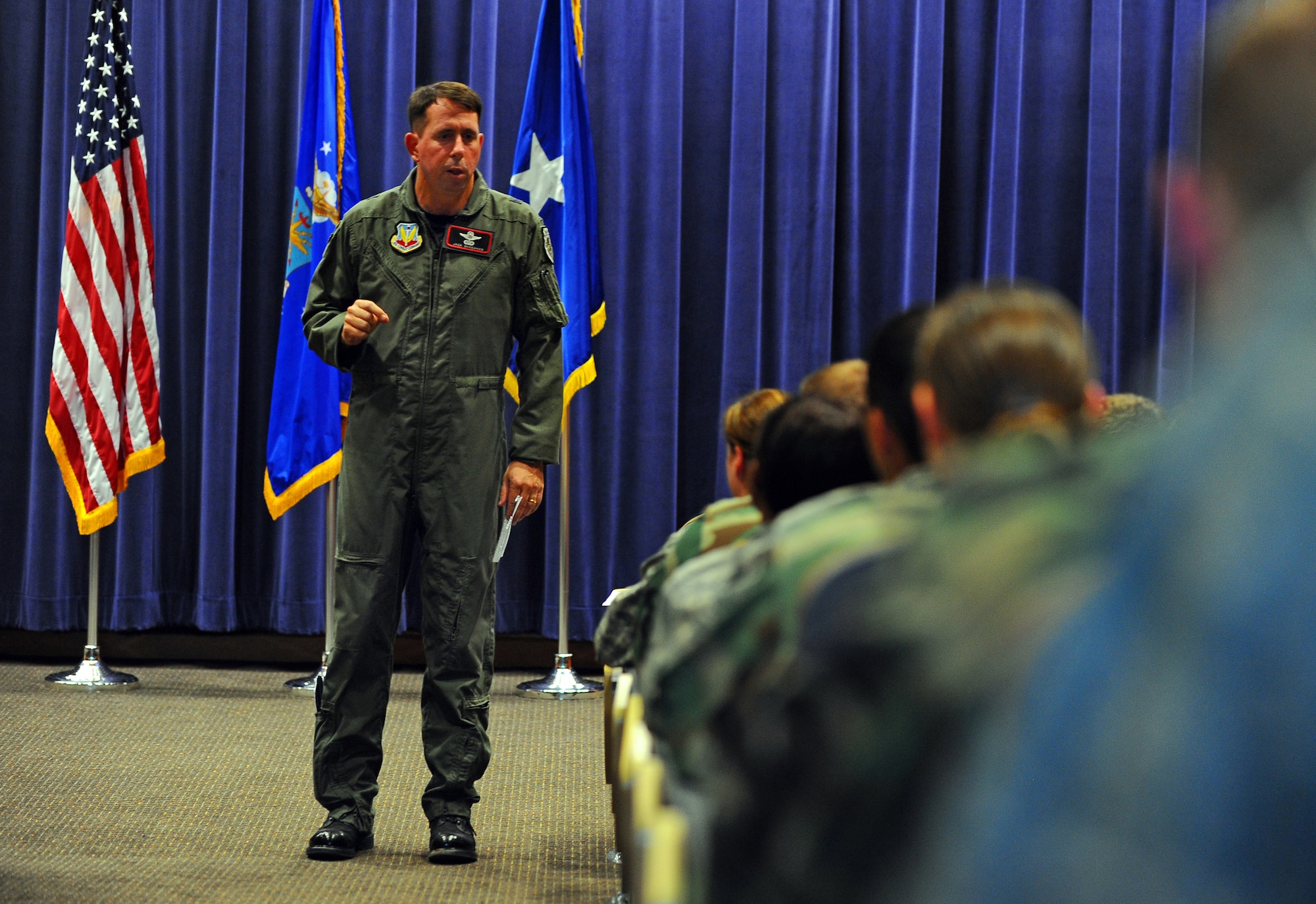 OFFUTT AIR FORCE BASE Neb. -- Brig. Gen. John N.T. Shanahan, 55th Wing commander, speaks to junior officers during the Company Grade Officer's Council meeting  in the Air Force Weather Agency's auditorium here July 14. During the meeting, the general spoke about numerous topics and addressed the concerns of Offutt's junior officers. U.S. Air Force Photo by Josh Plueger