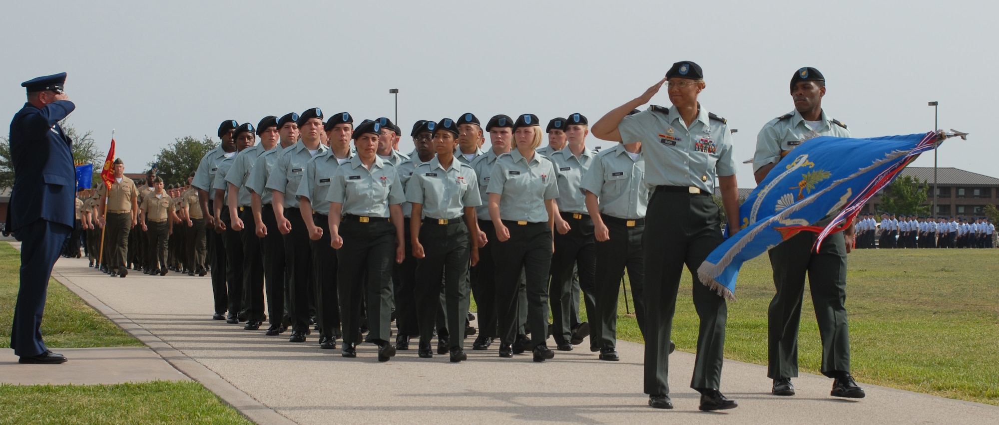 Lt. Col. Bichson Bush, 344th Military Intelligence Battalion commander, salutes Col. Richard Ayres during the pass and review following the change of command ceremony. (U.S. Air Force photo by Staff Sgt. Laura R. McFarlane) 