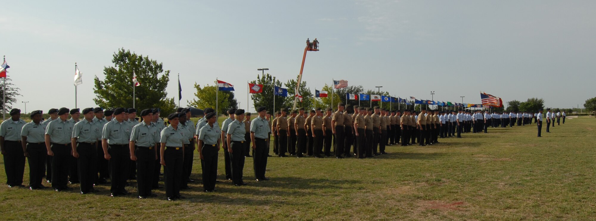 Soldiers, Sailors, Marines and Airmen stand in formation during the change of command ceremony. (U.S. Air Force photo by Staff Sgt. Laura R. McFarlane) 