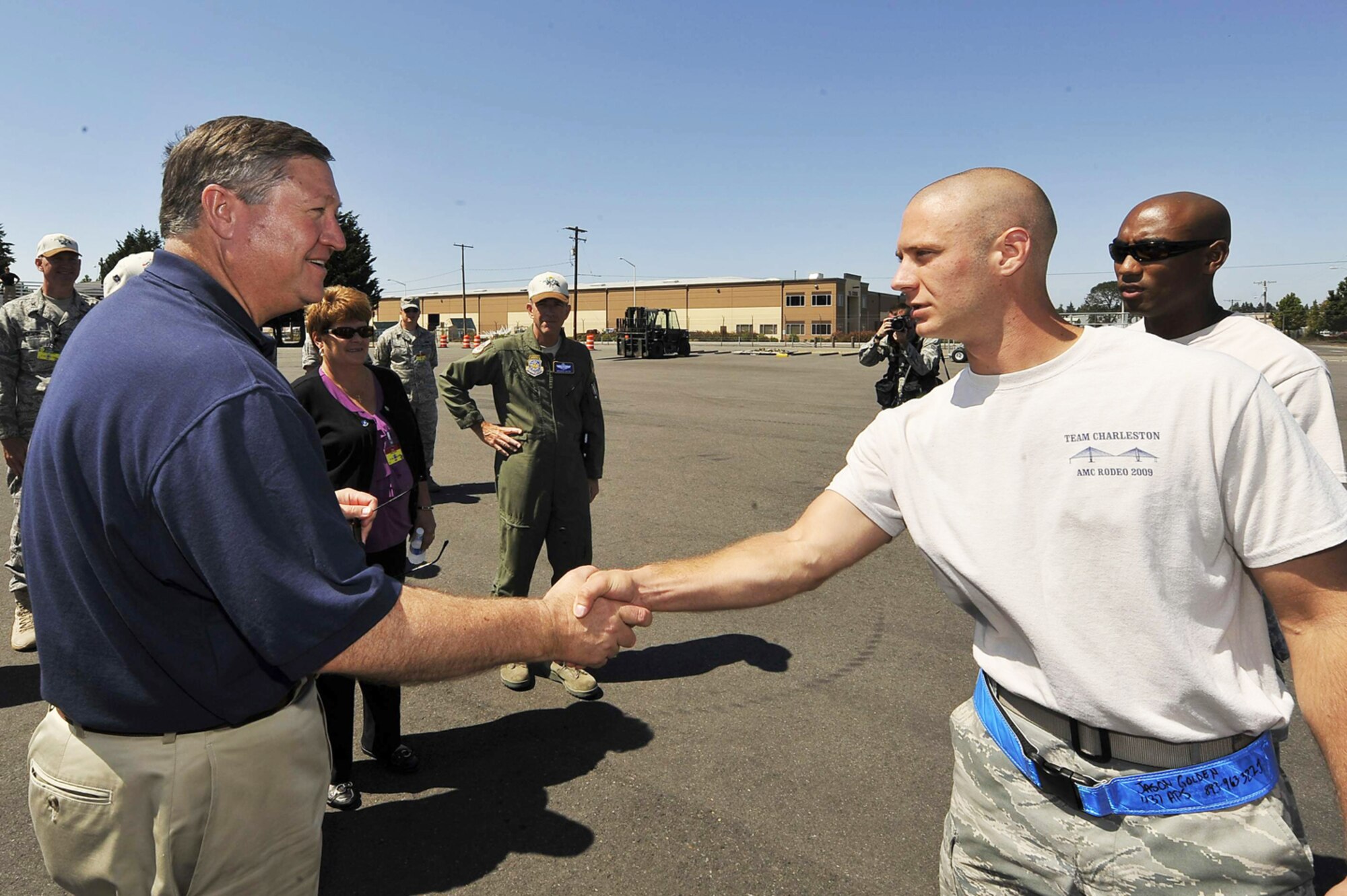 Senior Airman Jason Golden shakes hands with Secretary of the Air Force Michael B. Donley July 22 at McChord Air Force Base, Wash. Airman Golden just completed the 10K forklift event during Air Mobility Rodeo 2009. Airman Golden is assigned to the 437th Airlift Wing from Charleston Air Force Base, S.C. (U.S. Air Force photo/James M. Bowman) 
