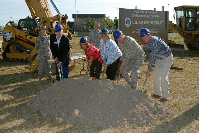 Left to right, Mr. Mike Waite, Ms. Cheryl Ulmer, Ms. Bonnie Keller, Major General Thomas Deppe and Mr. Greg Hebner break ground at the future site of the Malmstrom Air Force Bace Community Activity Center, Tuesday, July 21, 2009.