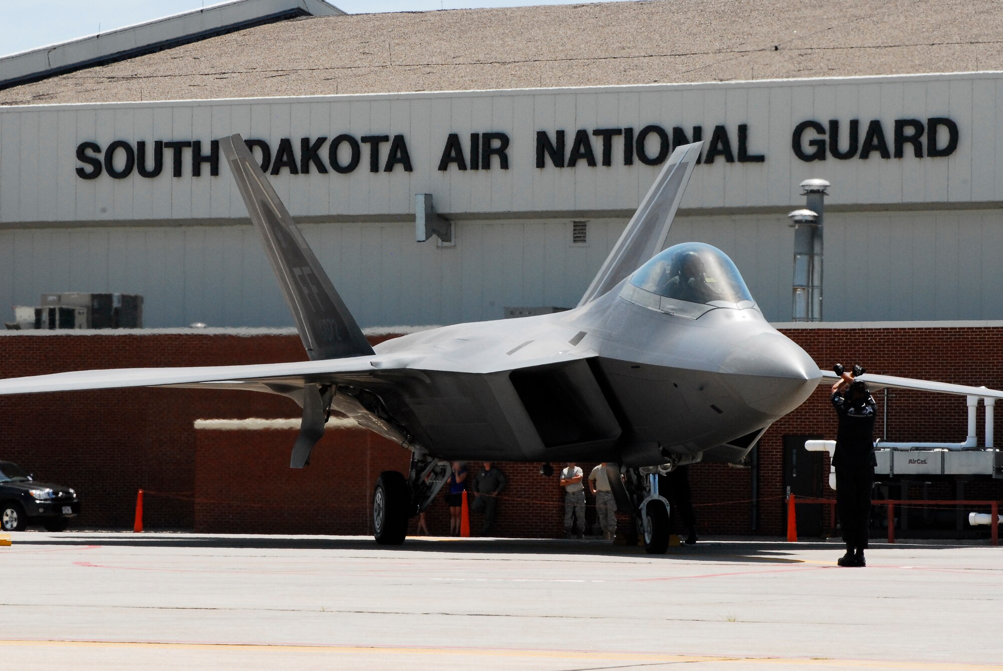 SIOUX FALLS, S.D. -- An F-22 with the Air Force demonstration team takes its place in the line-up at Joe Foss Field after arriving for the Sioux Falls Airshow July 23.  The Airshow was a two day event held at Joe Foss Field July 25-26. (U.S. Air Force photo by Staff Sgt. Quinton Young)