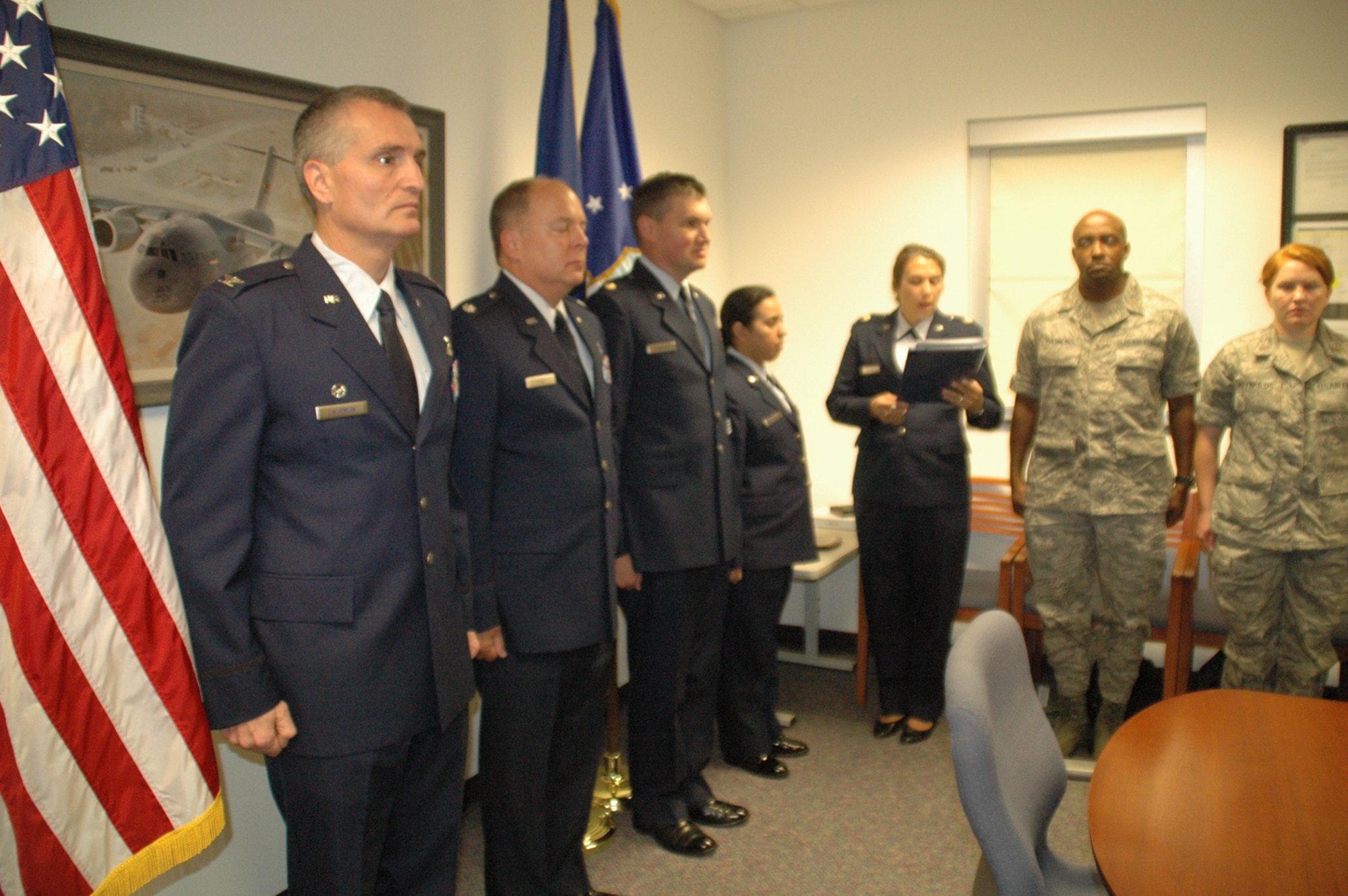 Colonel Steven Chapman, Commander of the 315th Airlift Wing, Charleston Air Force Base, S.C., presents Chaplain (Lt. Col.) Carl Yost and Chaplain (Maj.) John Painter with the Meritorious Service Medal, and Staff Sergeant  Jennifer Castellanos with the Air Force Achievement Medal.  All three members of the 315th Chaplain team received the medals for recent war time deployments. (Air Force photo / Maj Bill Walsh)