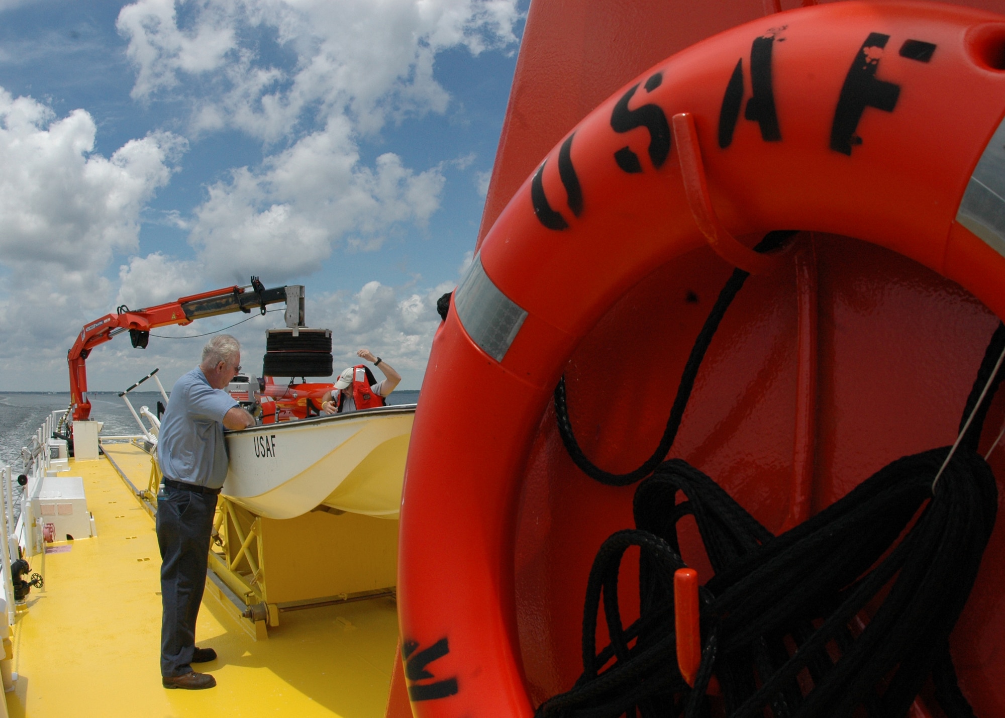 The crew from Florida Offshore prepare for a recovery demonstration July 22 in the waters off of Tyndall Air Force Base, Fla. The ship used for recovery is one of only three 120-foot boats owned by the Air Force. They are contracted from Florida Offshore through the 82nd Aerial Targets Squadron to help recover sub-scale drones after they are shot down during live fire exercises conducted by the 53rd Weapons Evaluation Group. (U.S. Air Force photo/Samuel King Jr.)