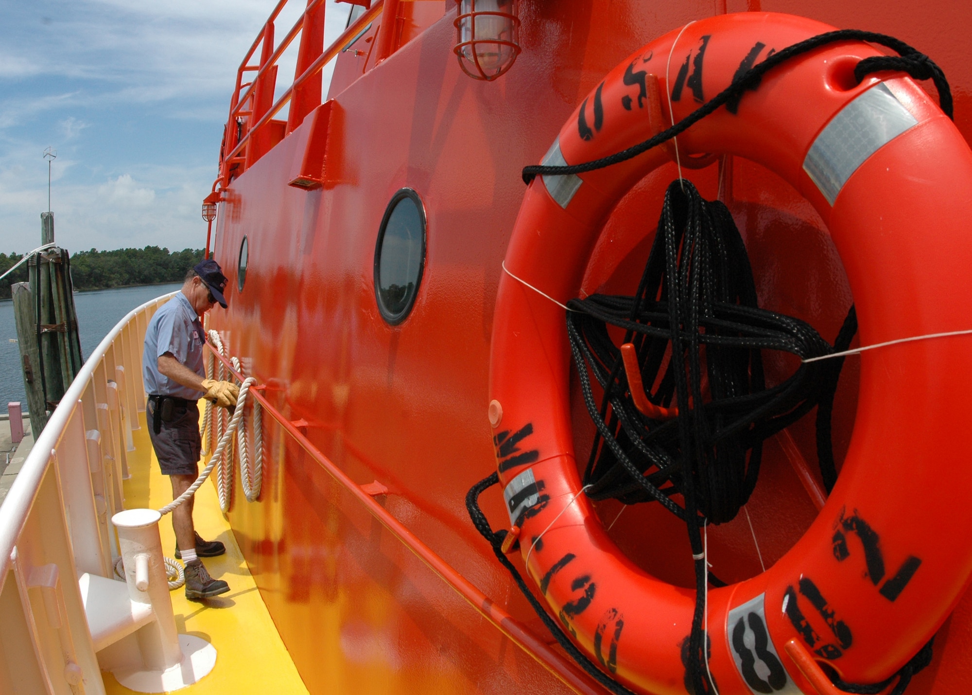 Byron Howle, a 82nd Aerial Targets Squadron contractor with Florida Offshore, secures a rope as the vessel leaves the docks July 22 at Tyndall Air Force Base, Fla. The boat is just one of only three 120-foot sea vessels owned by the Air Force used to recover sub-scale drones called BQM-167s after live fire exercises over the gulf. The ships recover approximately 25 of the $800,000 drones each year.  (U.S. Air Force photo/Samuel King Jr.)