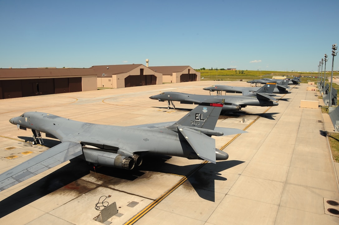 Five B-1B Lancers sit lined up on the flightline here, July 22.  Carrying the largest payload of both guided and unguided weapons in the Air Force inventory, the multi-mission B-1 is the backbone of America's long-range bomber force.  It can rapidly deliver massive quantities of precision and non-precision weapons against any adversary, anywhere in the world, at any time. (U.S. Air Force photo/Airman 1st Class Anthony Sanchelli)