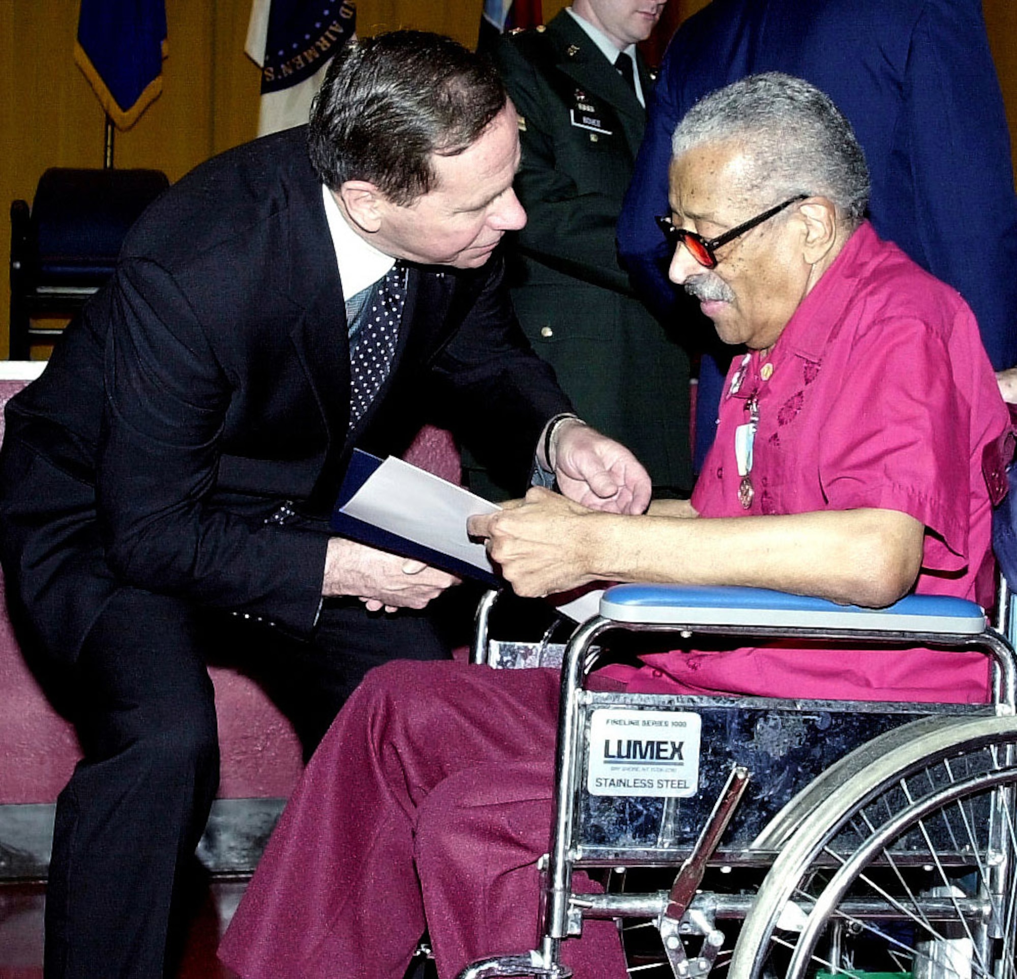 Recognition might come many years after the events. Here, Maj. Gen. (Ret.) Nels Running congratulates Eugene Mundy, who had just received the Korean War Service Medal from the Republic of Korea during a ceremony at the U.S. Soldiers’ and Airmen’s Home in Washington, D.C., in April 2001. Mundy, who served in the Air Force during the Korean War, was one of 34 veterans honored that day as part of the 50th anniversary of the Korean War. (U.S. Air Force photo)