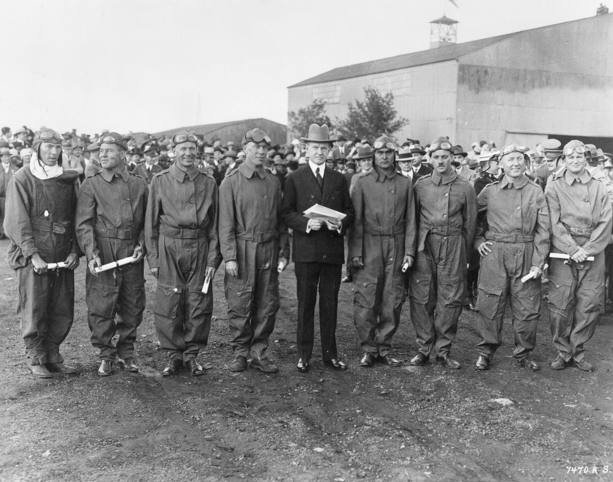 President Calvin Coolidge presents Distinguished Flying Cross citations to the Pan American Fliers on May 2, 1927. The first to circumnavigate South America by air, they were (left to right): 1st Lt. Charles Robinson, Capt. Arthur McDaniel, 1st Lt. Ennis Whitehead, Maj. Herbert Dargue, President Coolidge, Capt. Ira Eaker, 1st Lt. Muir Fairchild, 1st Lt. Bernard Thompson and 1st Lt. Leonard Weddington. They received the actual medals at a later date. (U.S. Air Force photo)
