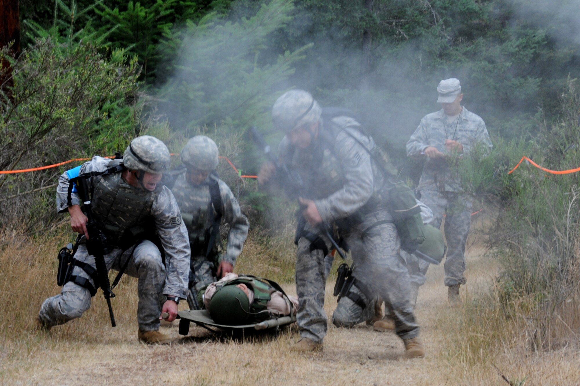 SEYMOUR JOHNSON AIR FORCE BASE, N.C. -- Fireteam members from the 916th Security Forces Squadron respond to a scenario involving a possible chemical attack during a mock rescue operation. The Airmen are participating in Air Mobility Command's 2009 RODEO competition. (U.S. Air Force photo/TSgt. Scotty Sweatt, 916ARW/PA)