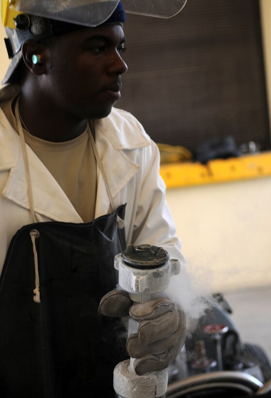Senior Airman Craigory Bratcher, a 39th Logistics Readiness Squadron fuels management technician, prepares to transfer liquid oxygen, or LOX, from a holding tank to a portable tank Thursday, July 23, 2009 at Incirlik Air Base, Turkey. Airmen part of the “Brew Crew,” a fuels management section in charge of LOX, ensures its contents meets standards for it to be used in aircraft oxygen systems. When exposed to the open air, the minus 297 degree LOX evaporates into a gas. (U.S. Air Force photo/Senior Airman Alex Martinez)