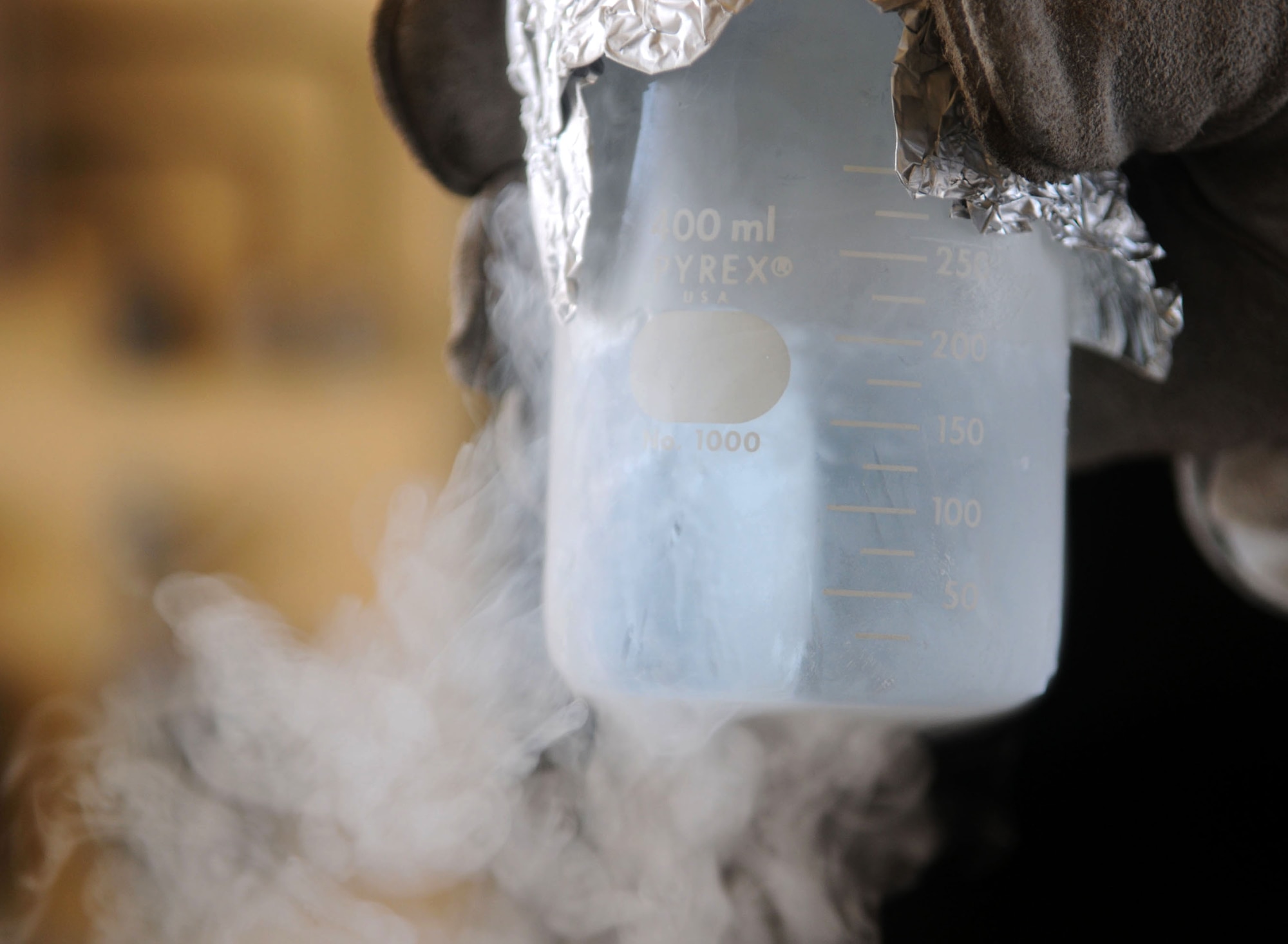 A 39th Logistics Readiness Squadron fuels management technician quality checks liquid oxygen, or LOX, Thrusday, July 23, 2009 at Incirlik Air Base, Turkey. Airmen part of the “Brew Crew,” a fuels management section in charge of LOX, ensures its contents meets standards for it to be used in aircraft oxygen systems. When exposed to the open air, the minus 297 degree LOX evaporates into a gas. (U.S. Air Force photo/Senior Airman Alex Martinez)