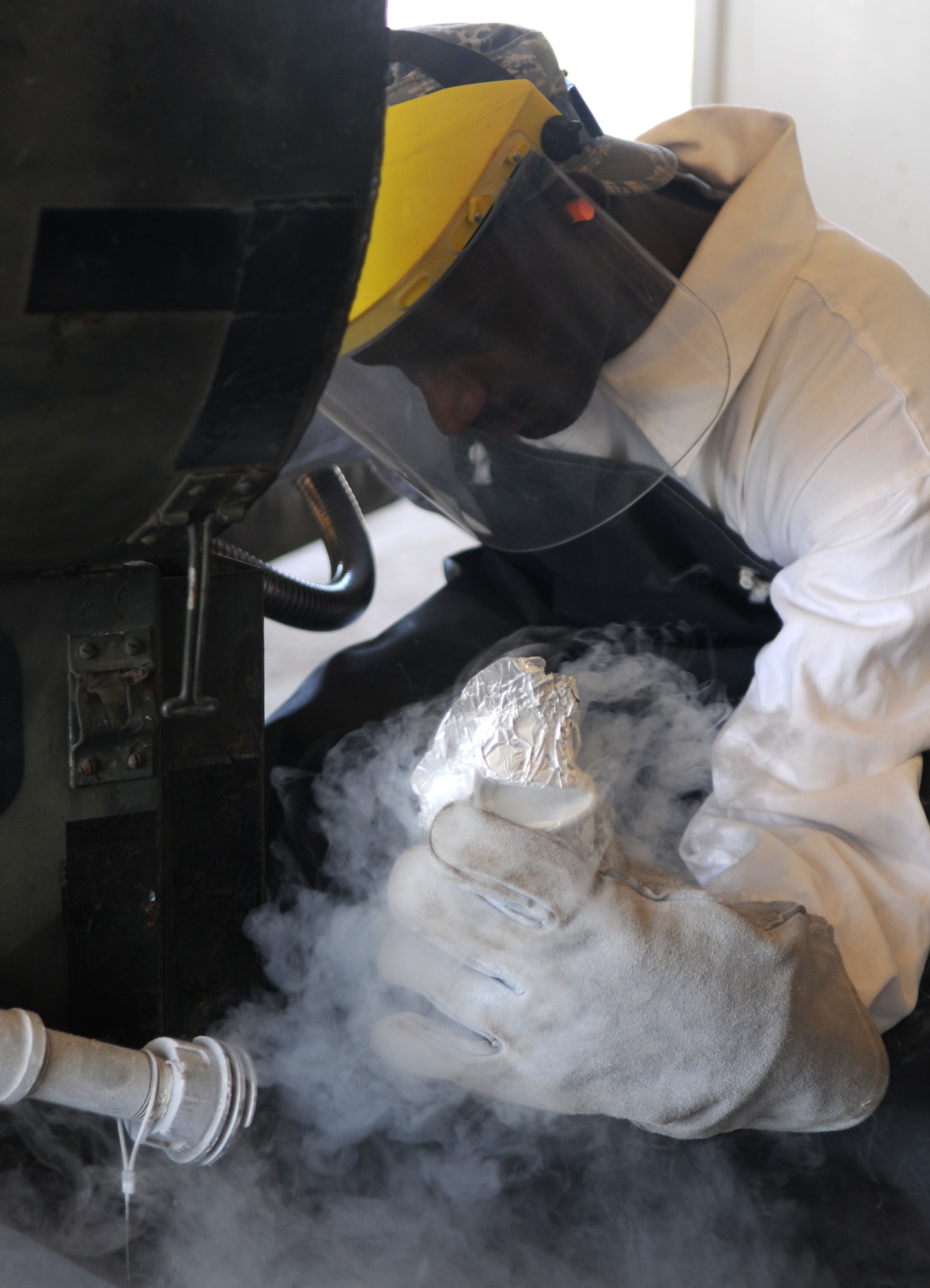 Staff Sgt. Lee Gore, a 39th Logistics Readiness Squadron fuels management technician, quality checks liquid oxygen, or LOX, Thursday, July 23, 2009 at Incirlik Air Base, Turkey. Airmen part of the “Brew Crew,” a fuels management section in charge of LOX, ensures its contents meets standards for it to be used in aircraft oxygen systems. When exposed to the open air, the minus 297 degree LOX evaporates into a gas. (U.S. Air Force photo/Senior Airman Alex Martinez)