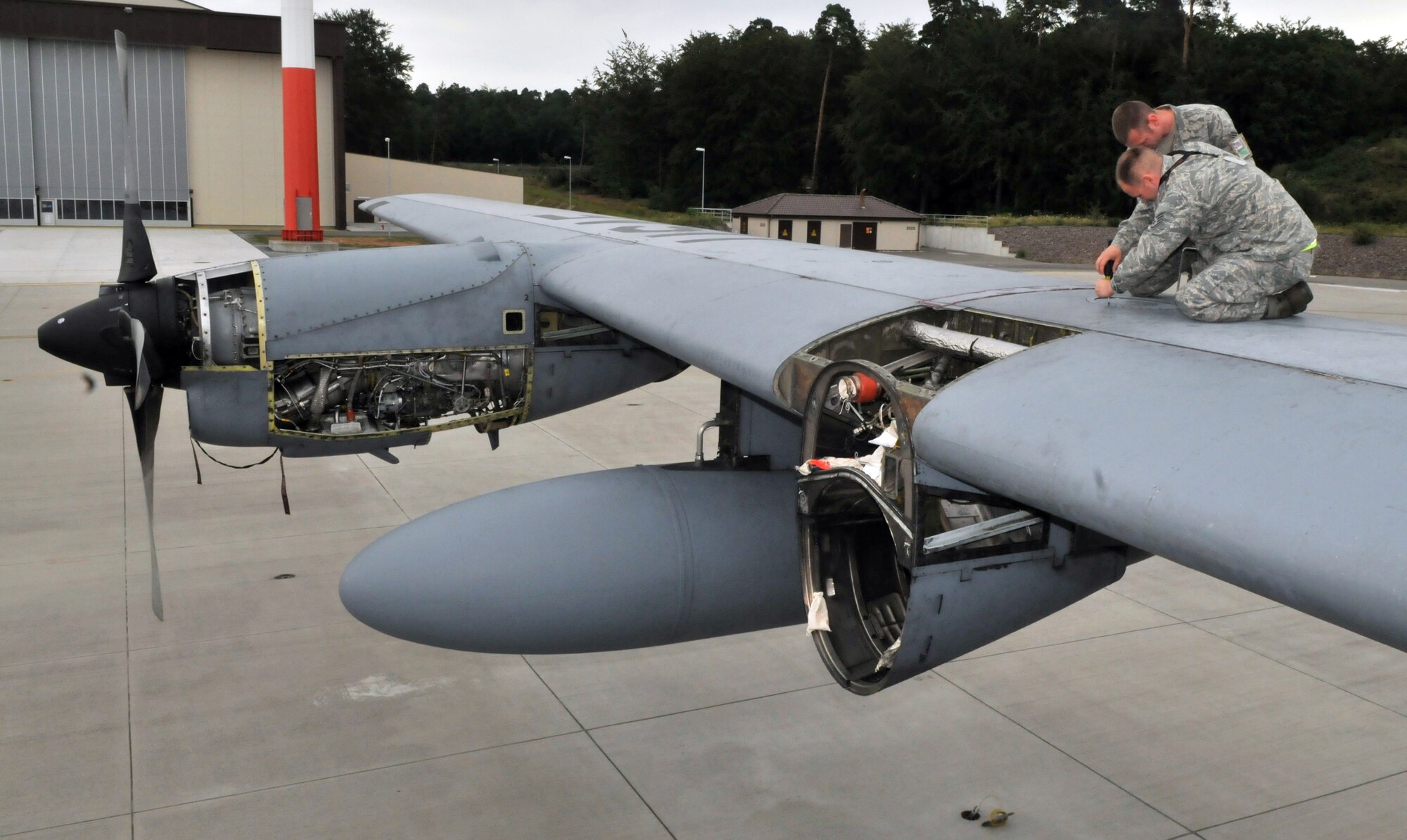 U.S. Air Force Airmen from the 86th Maintenance Squadron perform an isochronical inspection on a C-130E Hercules, July 22, 2009, Ramstein Air Base, Germany. This is the final ISO inspection on the C-130E Hercules on Ramstein as the base continues to replace the C-130E with the new C-130J Super Hercules. (U.S. Air Force photo by Senior Airman Nathan Lipscomb)