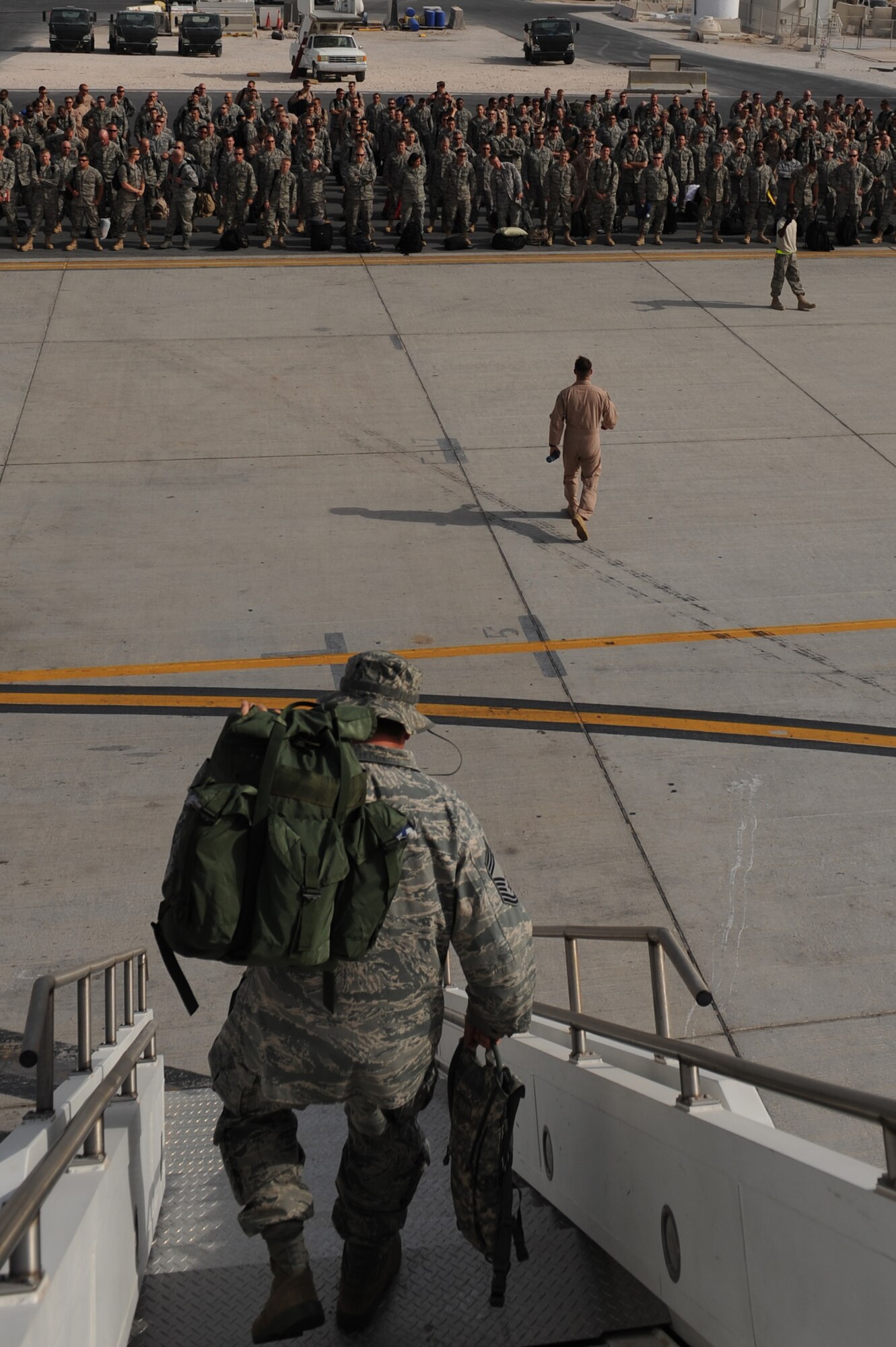 Servicemembers arrive at their deployed location in Southwest Asia, July 21. They are deployed to the 379th Air Expeditionary Wing in various roles supporting Operations Iraqi and Enduring Freedom. (U.S. Air Force Photo/Staff Sgt. Robert Barney)